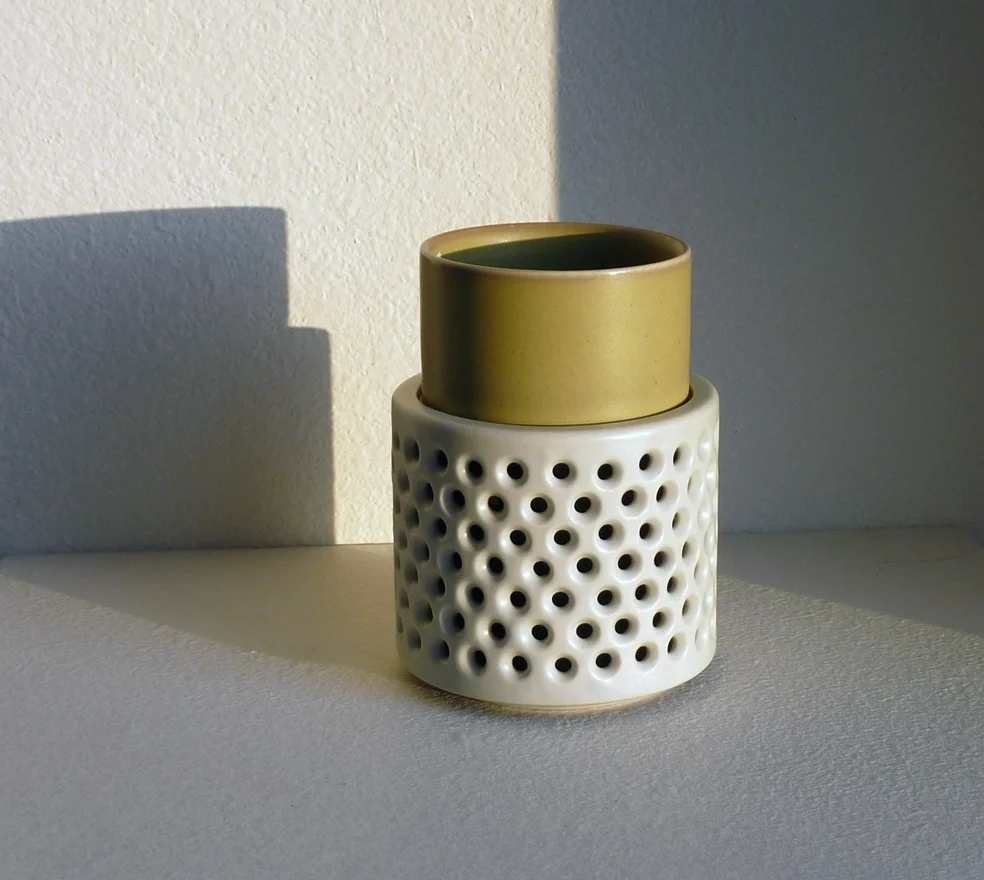double walled cup with perforated "handle"