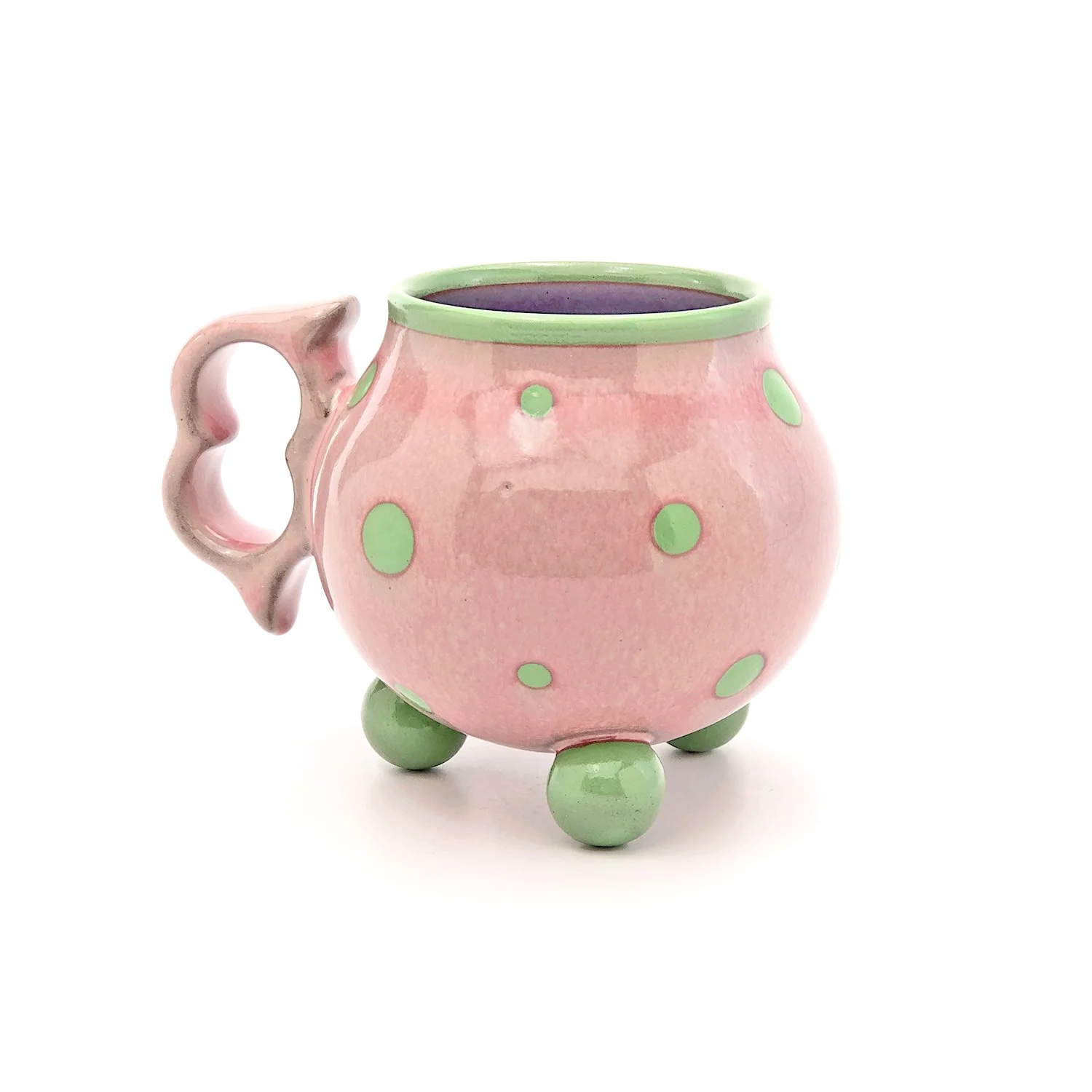 13oz. Light pink polka tripod mug with ergonomic two finger handle.