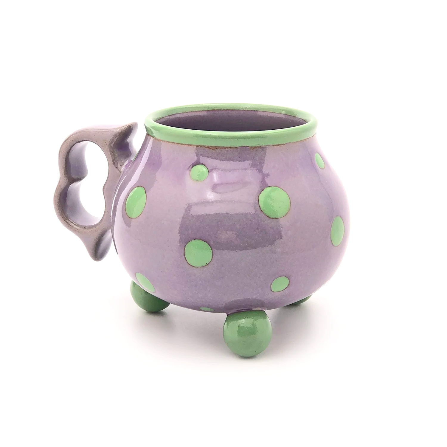 16oz. Violet tripod mug with ergonomic two finger handle.