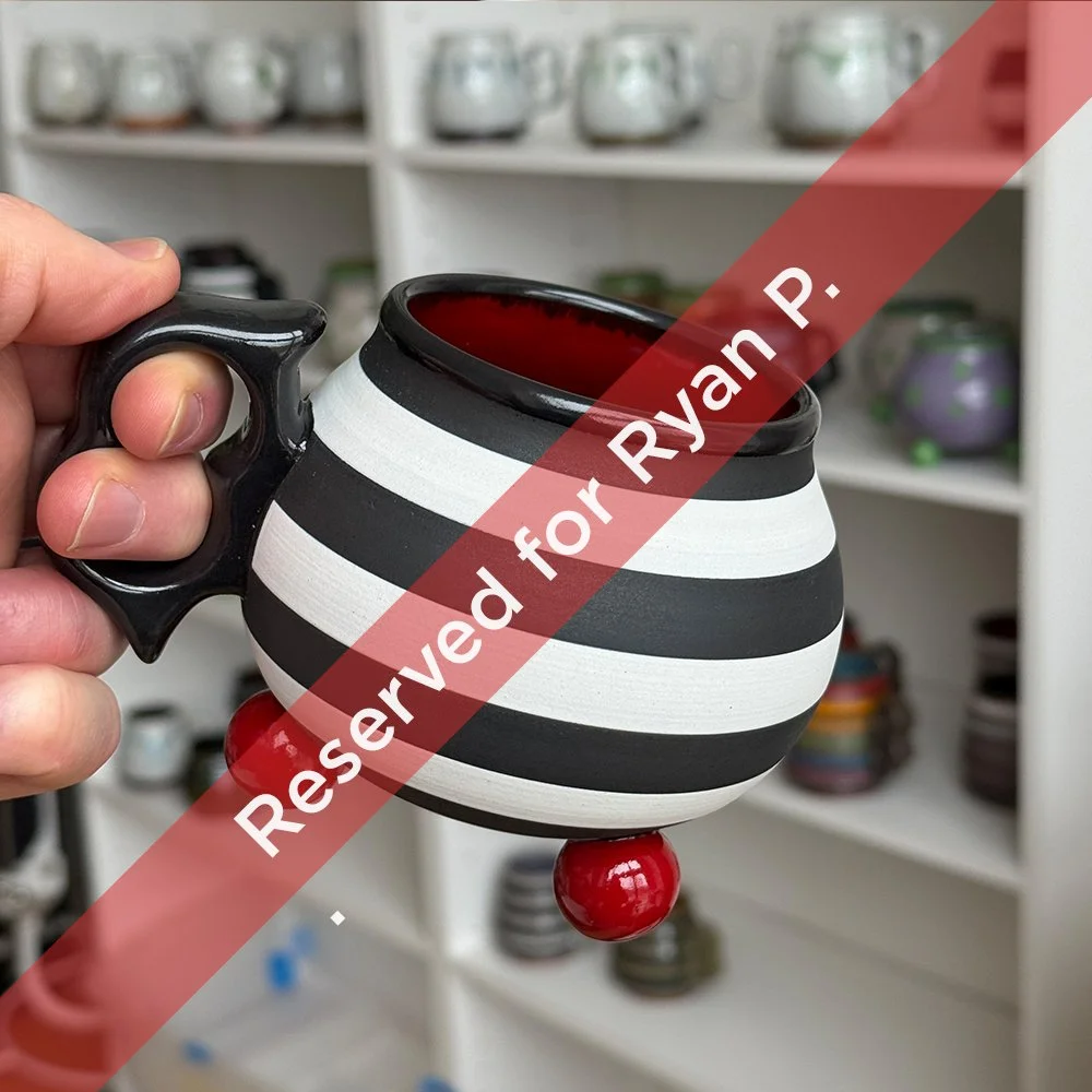 Reserved: Black and white Ball Footie with ergonomic two finger handle