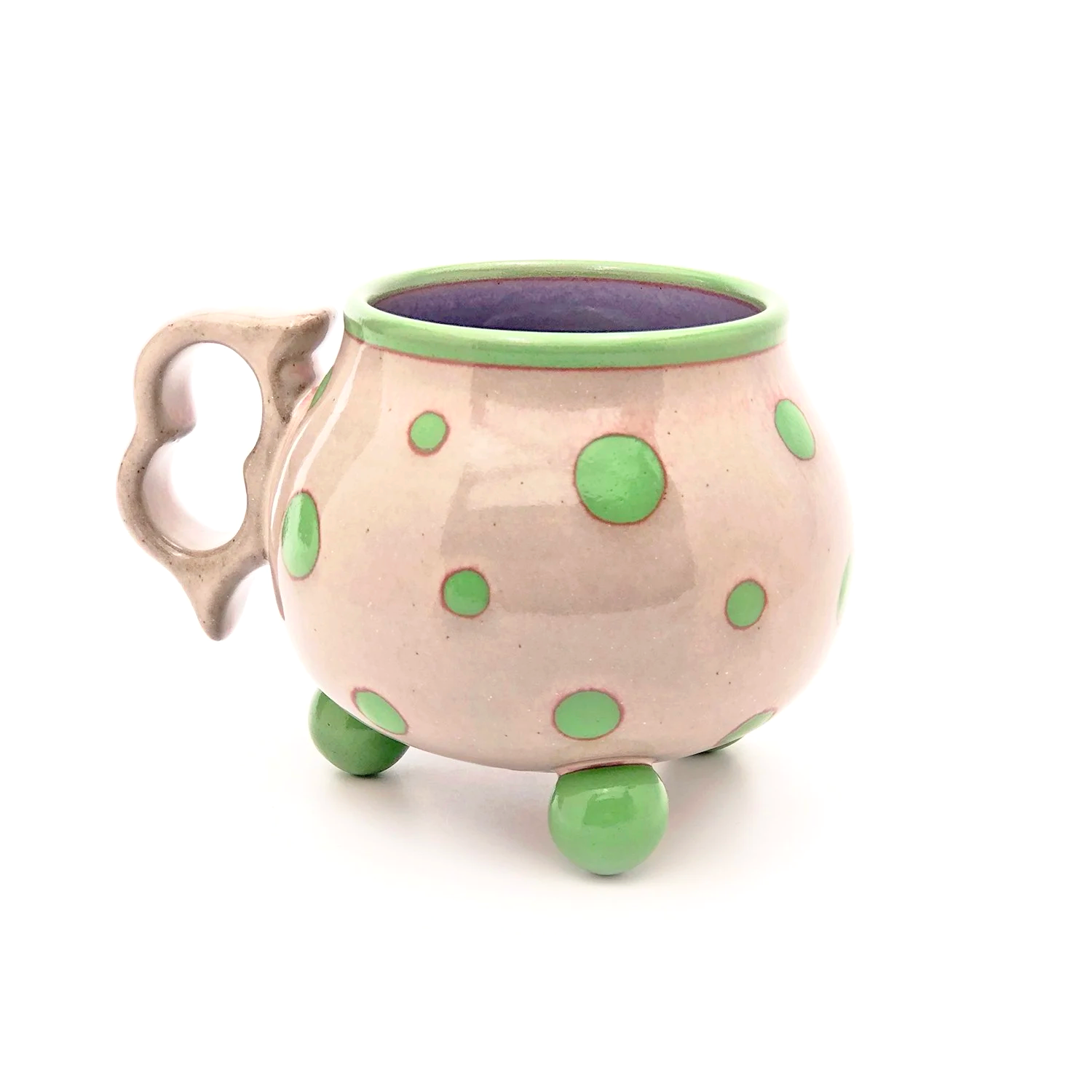 16oz. Light pink polka tripod mug with ergonomic two finger handle.