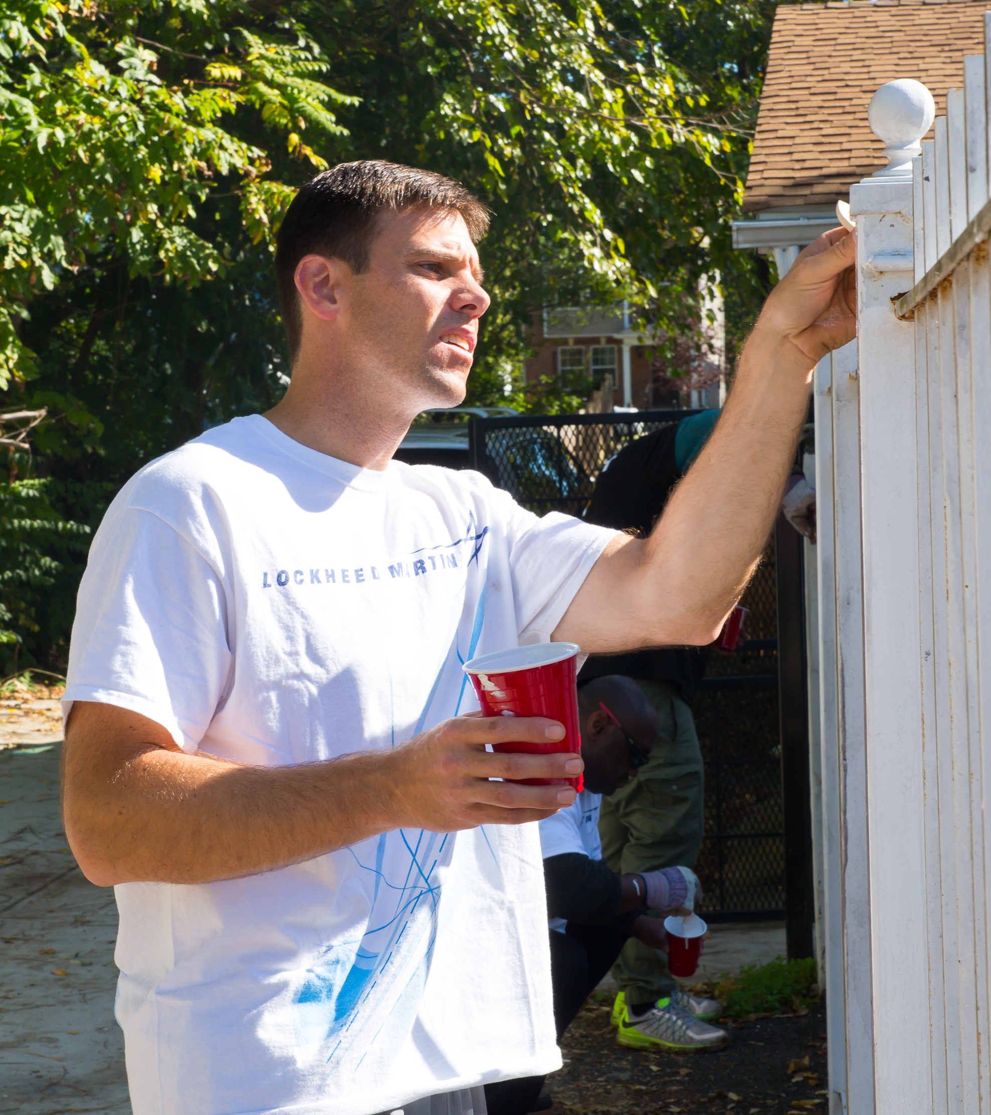 Veterans-Man-Painting-Picket-Fence-Lockheed-Bethesda.jpg