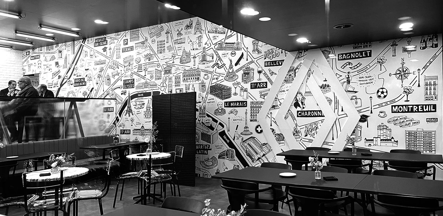 Photograph of the Renault restaurant wall at the Paris Motor Show. The wall has a hand drawn pen and ink illustrated map of Paris printed onto it.