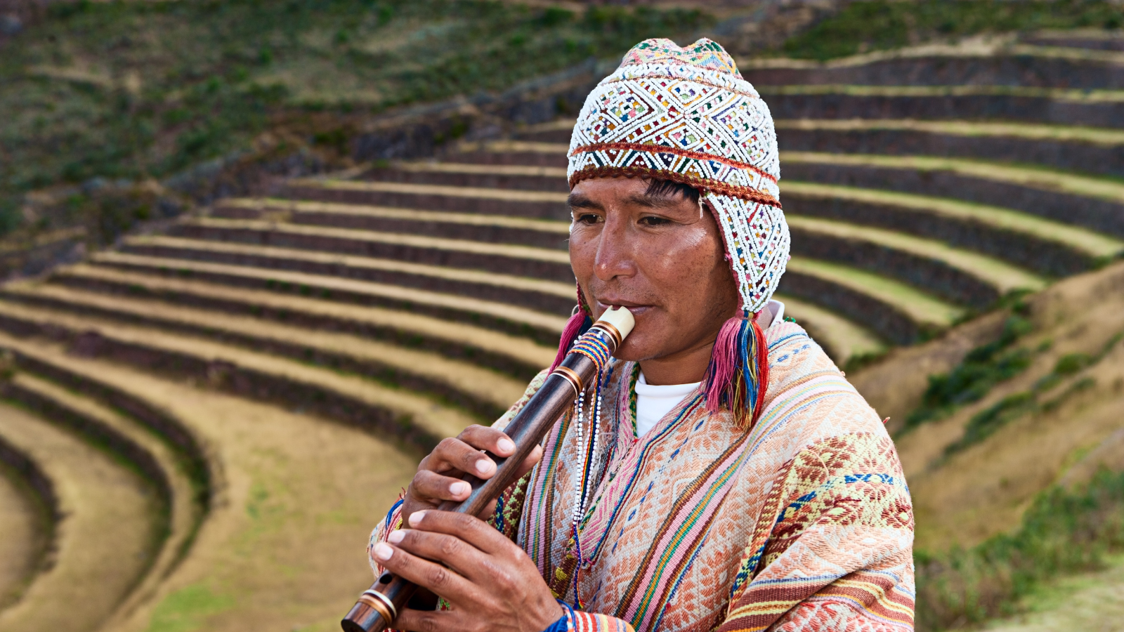 Copy of peruvian man playing flute pisac Twitter Post (1).png