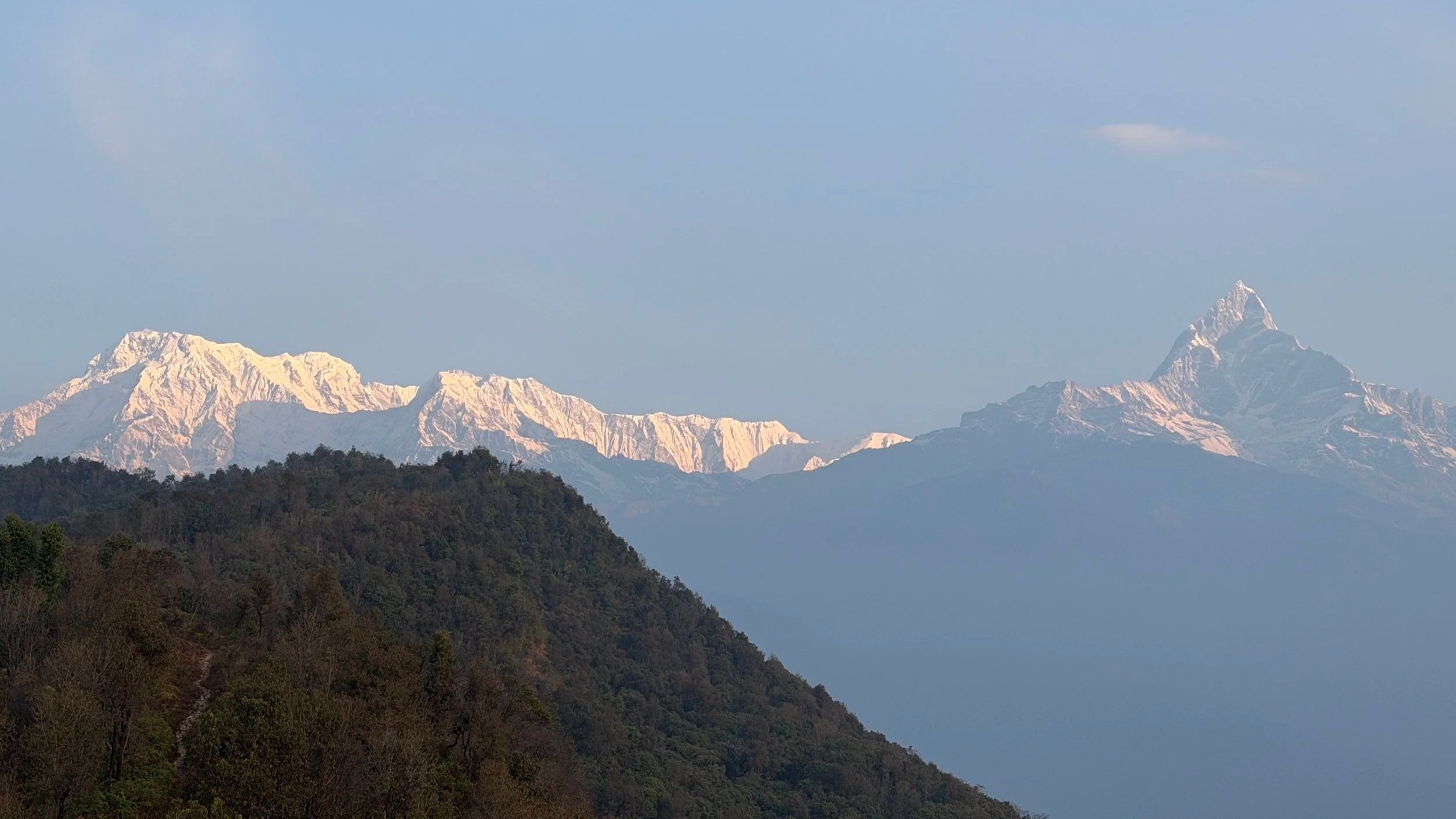 snow-capped peaks of the Himalayas glowing in the morning light during an Outer Banks Yoga international retreat.