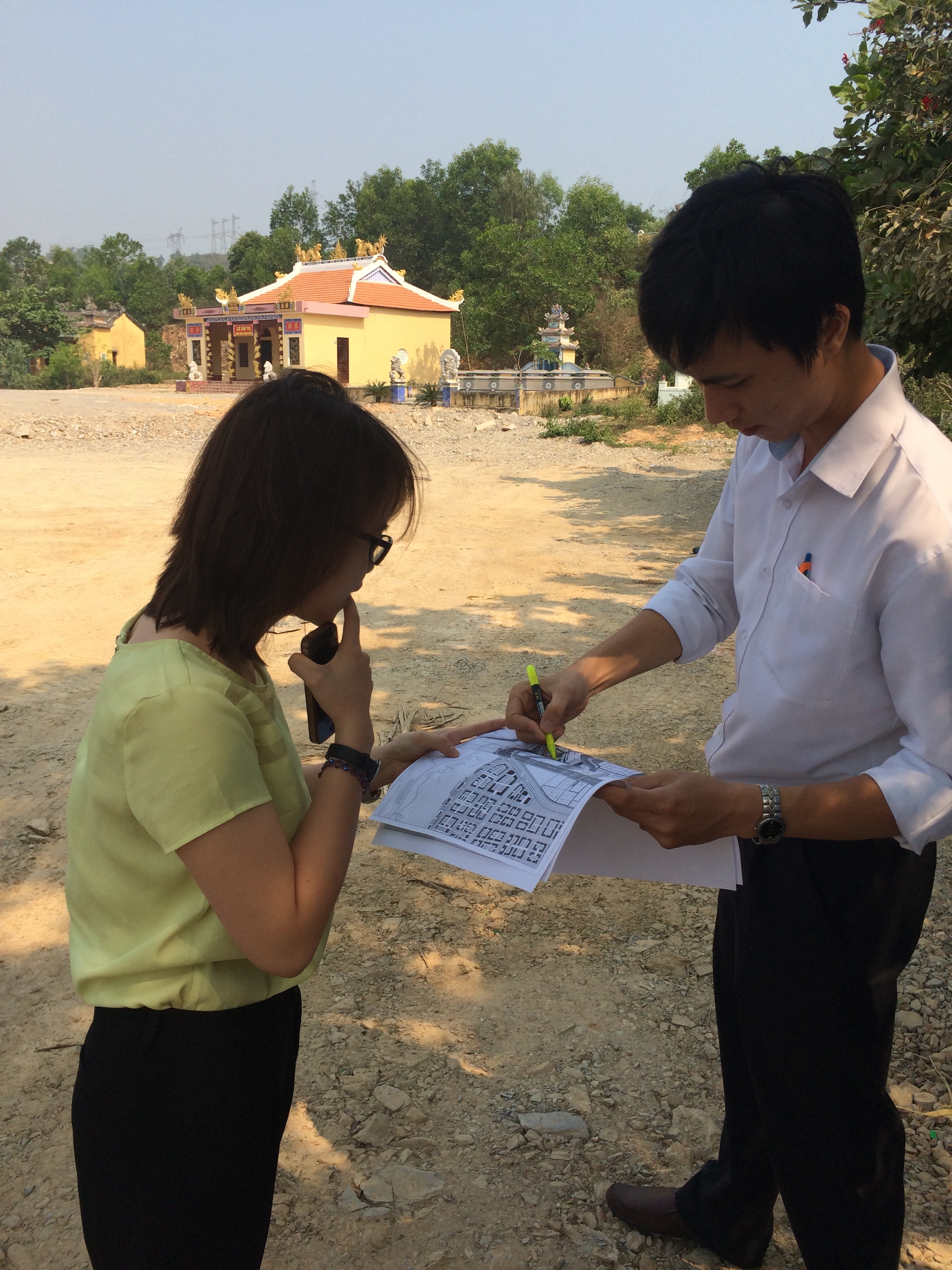 Reviewing plans at the site of the new water treatment plant in Da Nang, Vietnam