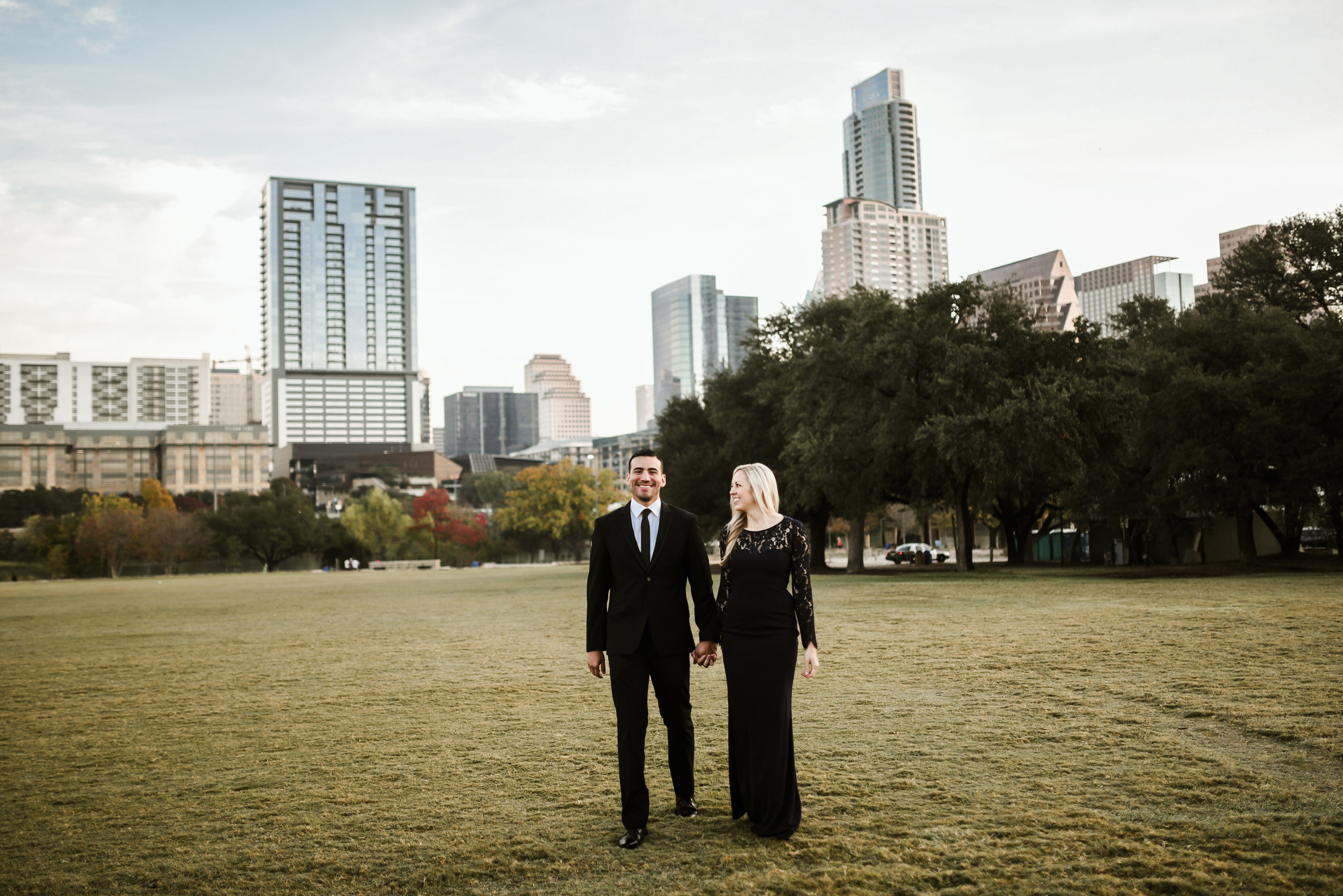 Who says black and blue don't match? When done right, it can be so glamorous! Here, Luis wears a classic black suit while Jenn dons a long navy gown.
