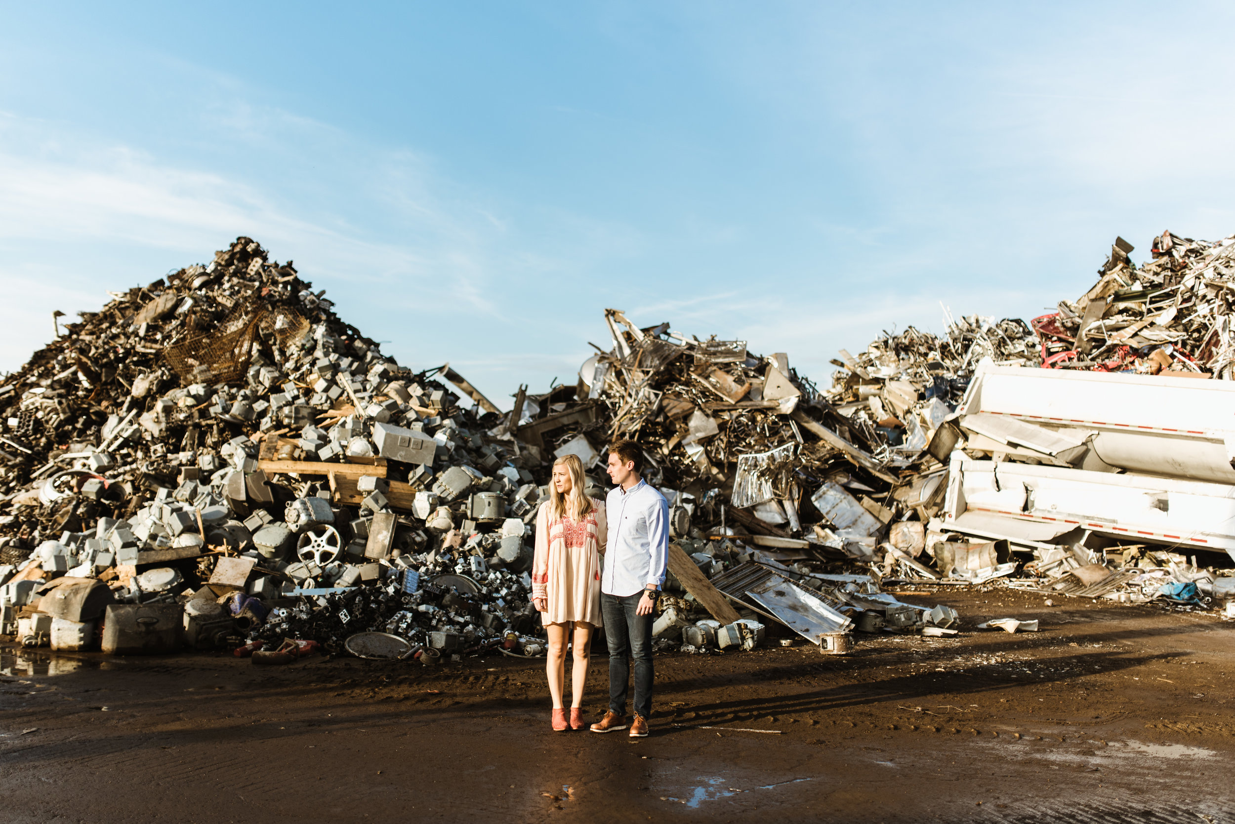 For this session, I had Mandy and Kevin meet me in a scrapyard at sunrise. Here's juxtaposition at work again. She's a nice dress and amazing shoes while Keven sports a contrasting button up, fitted jeans and nice shoes.