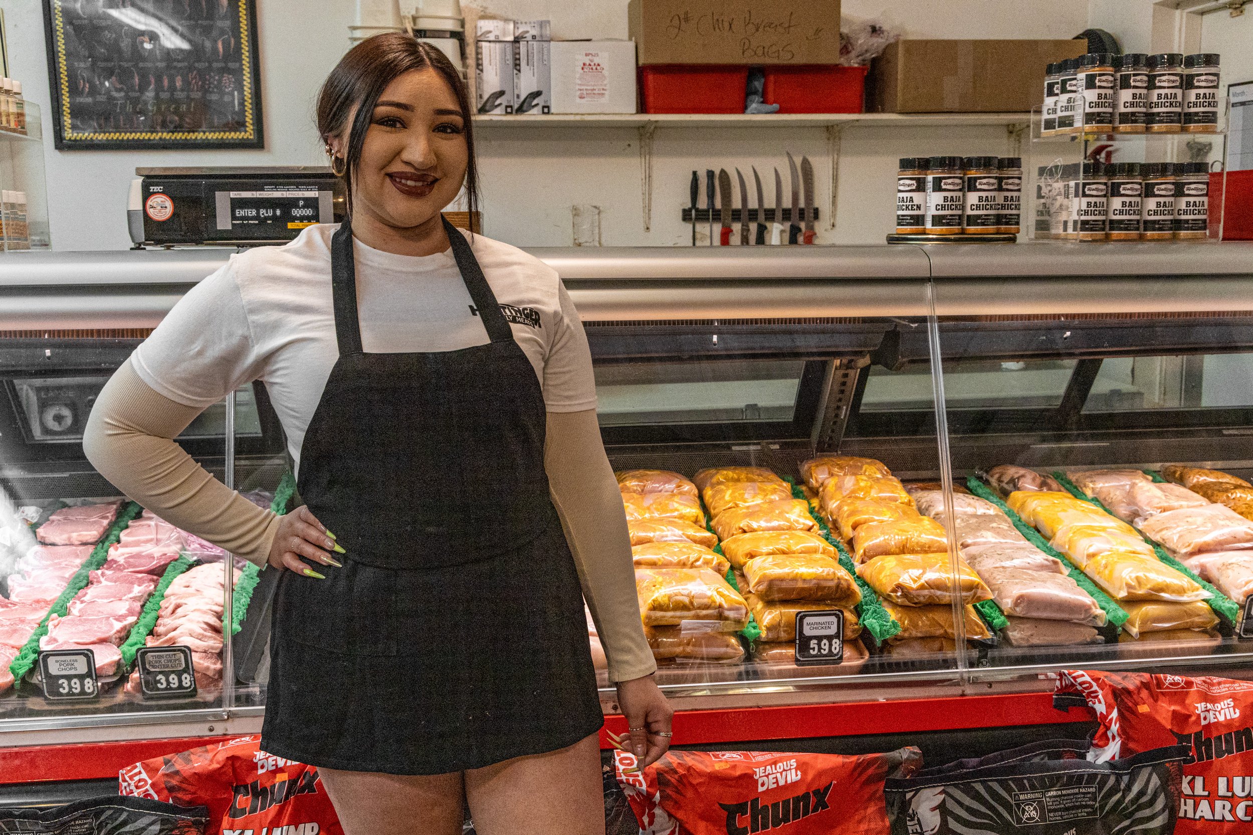 Photograph of employee Darlene, who is in charge of the marinated chicken.