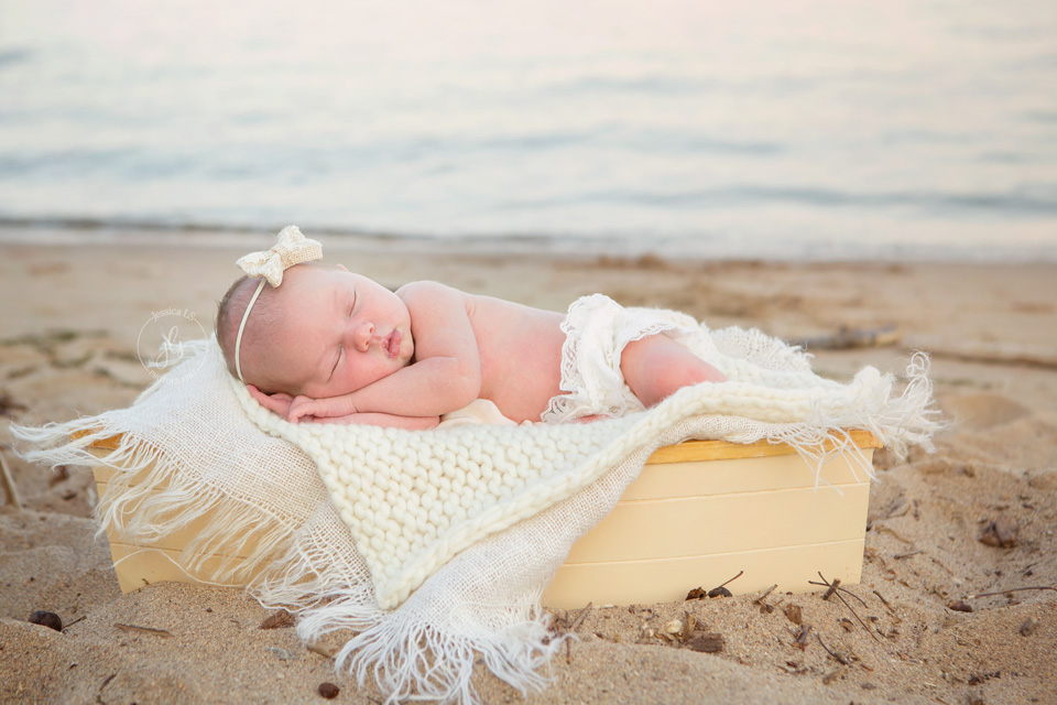 outdoor newborn session with baby in boat