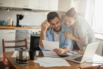 Couple checking paperwork.PNG