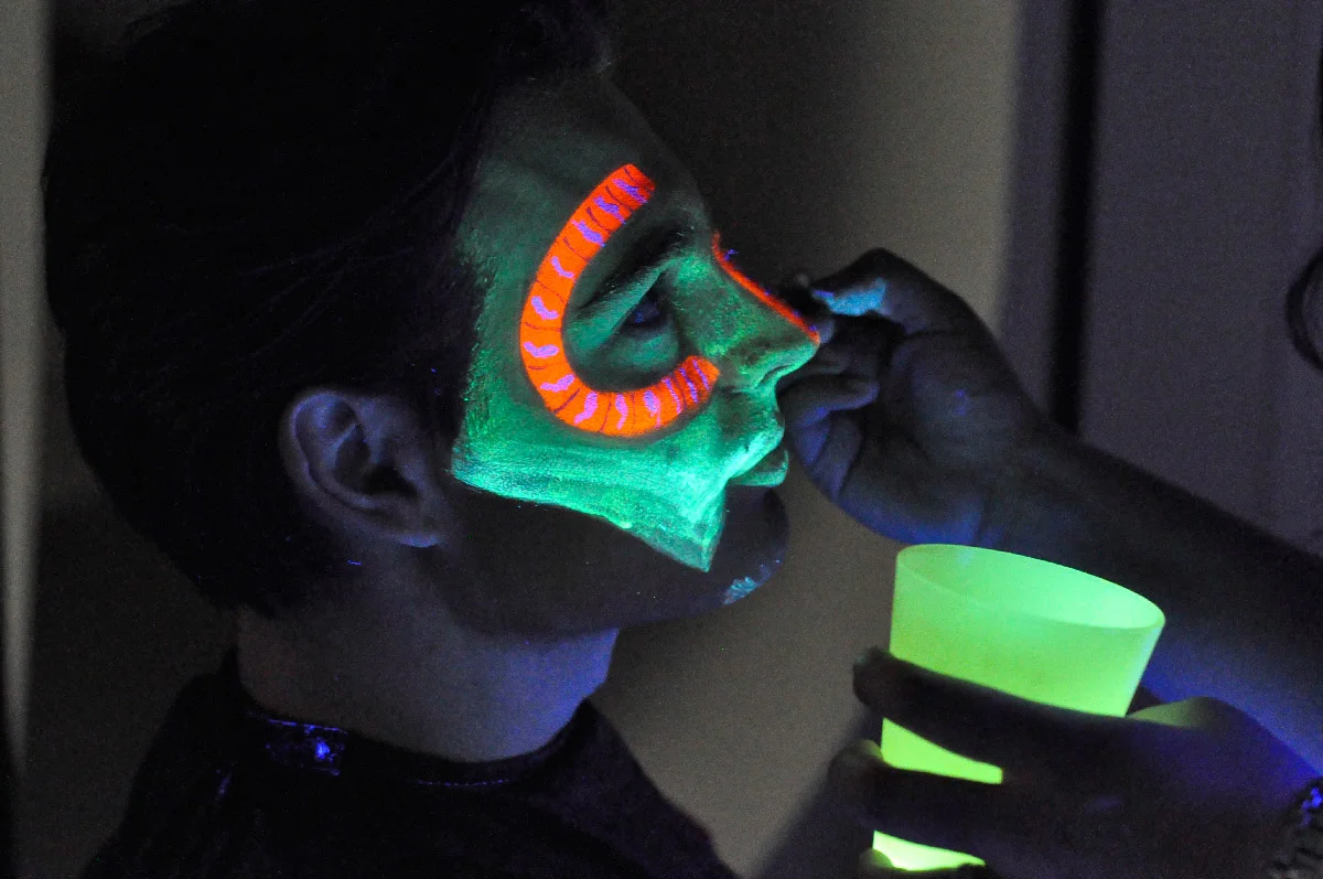  Phosphorescent makeup was used for filming under black light. Later on in post-processing the footage of the actors was merged with the on location footage. 