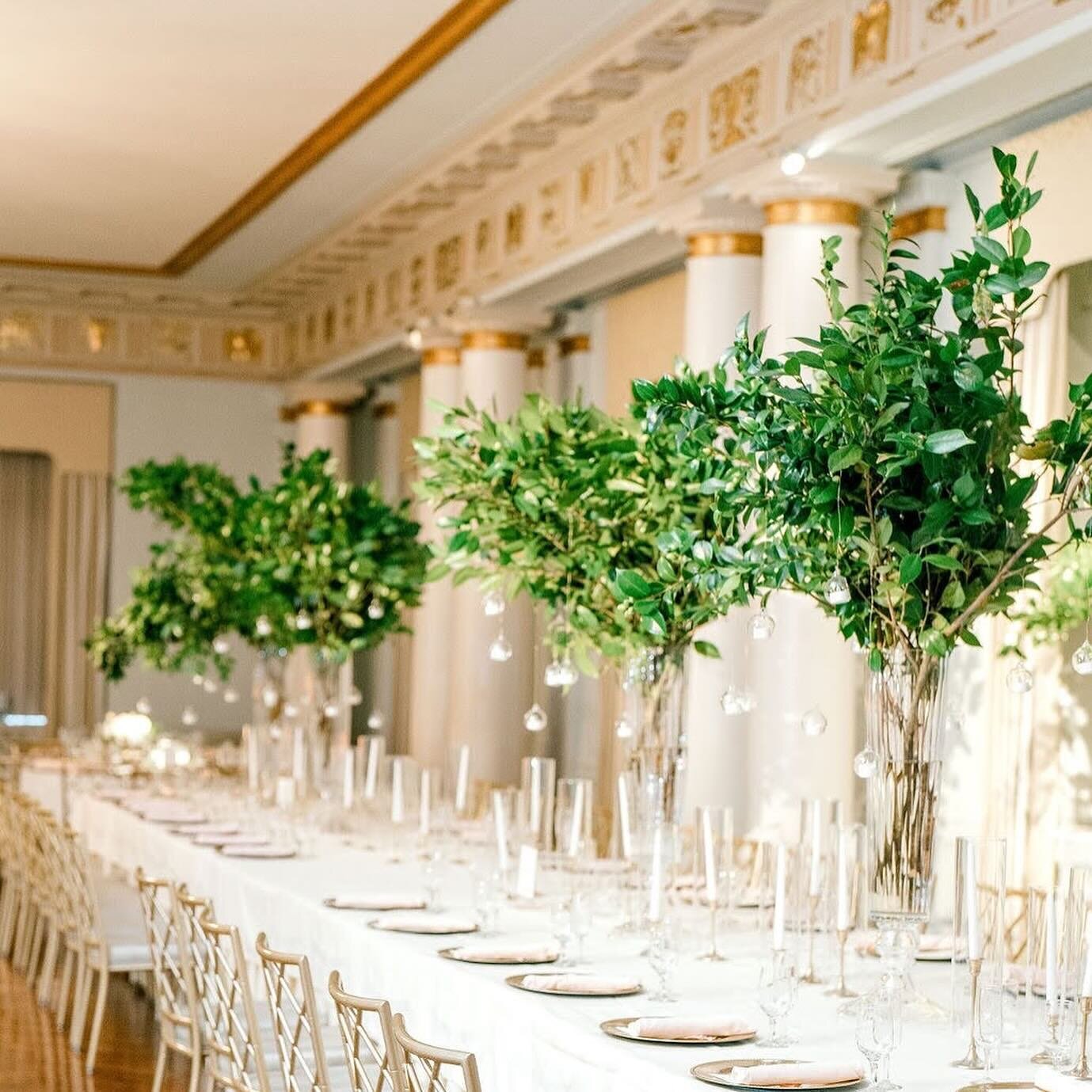 I loved these &ldquo;tree&rdquo; centerpieces for Maddie and Mike&rsquo;s December wedding. We wanted to appropriately compliment the season without veering into Christmas territory. The camellia branches were the perfect foliage and the hanging voti