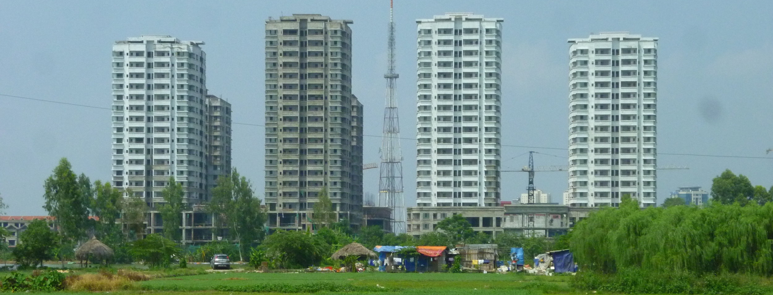 A new mixed-use development rises from the paddy fields on the periphery of Hanoi. Photo by Clément Musil (2012).