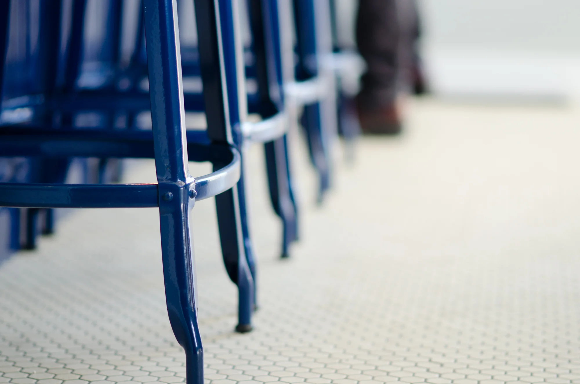 blue metal stools and hex tile floor