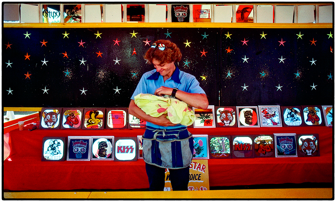 Carnie holding his baby, Sonoma County Fair, 1976