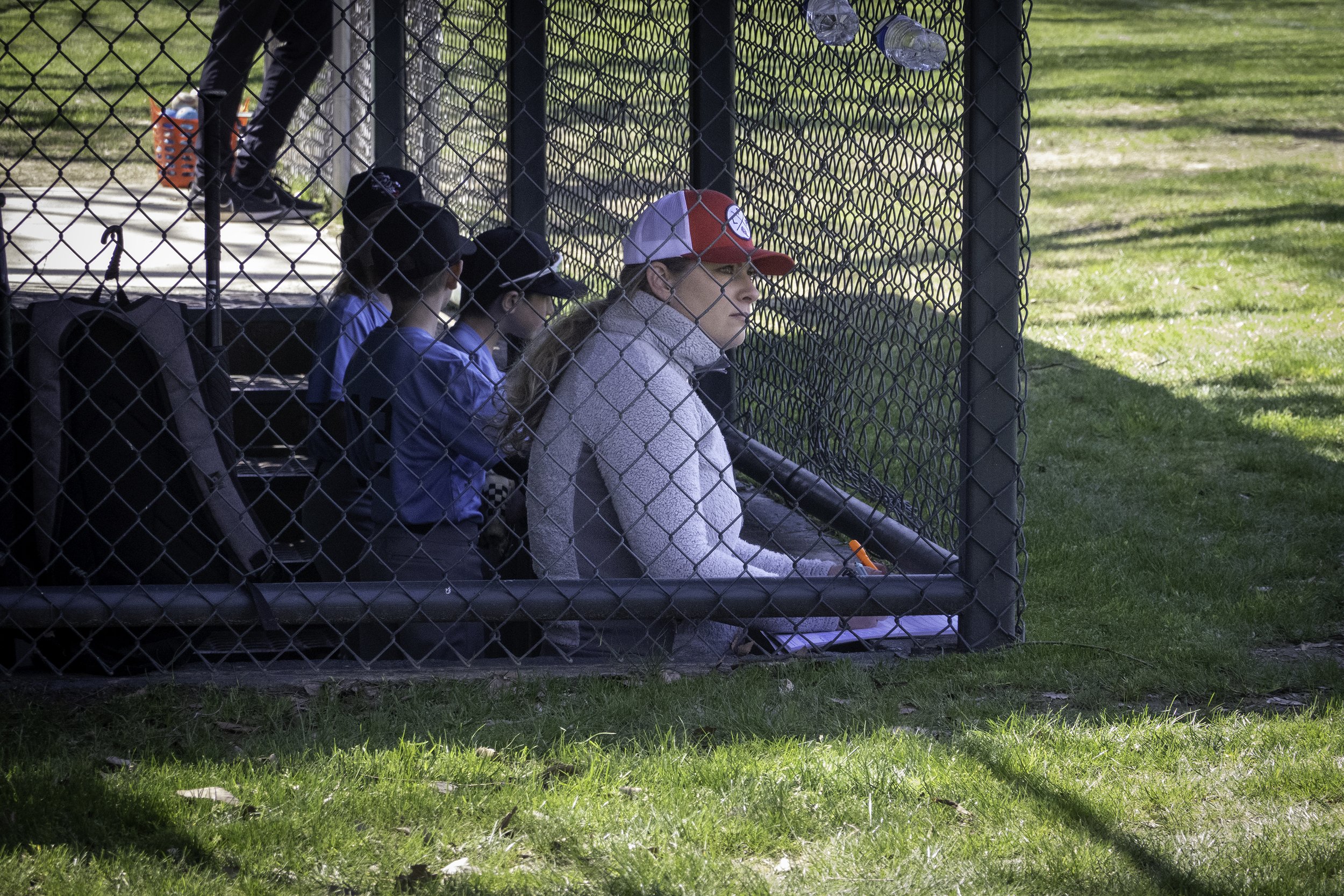 Kim, the official pitch counter, takes her spot in the dugout