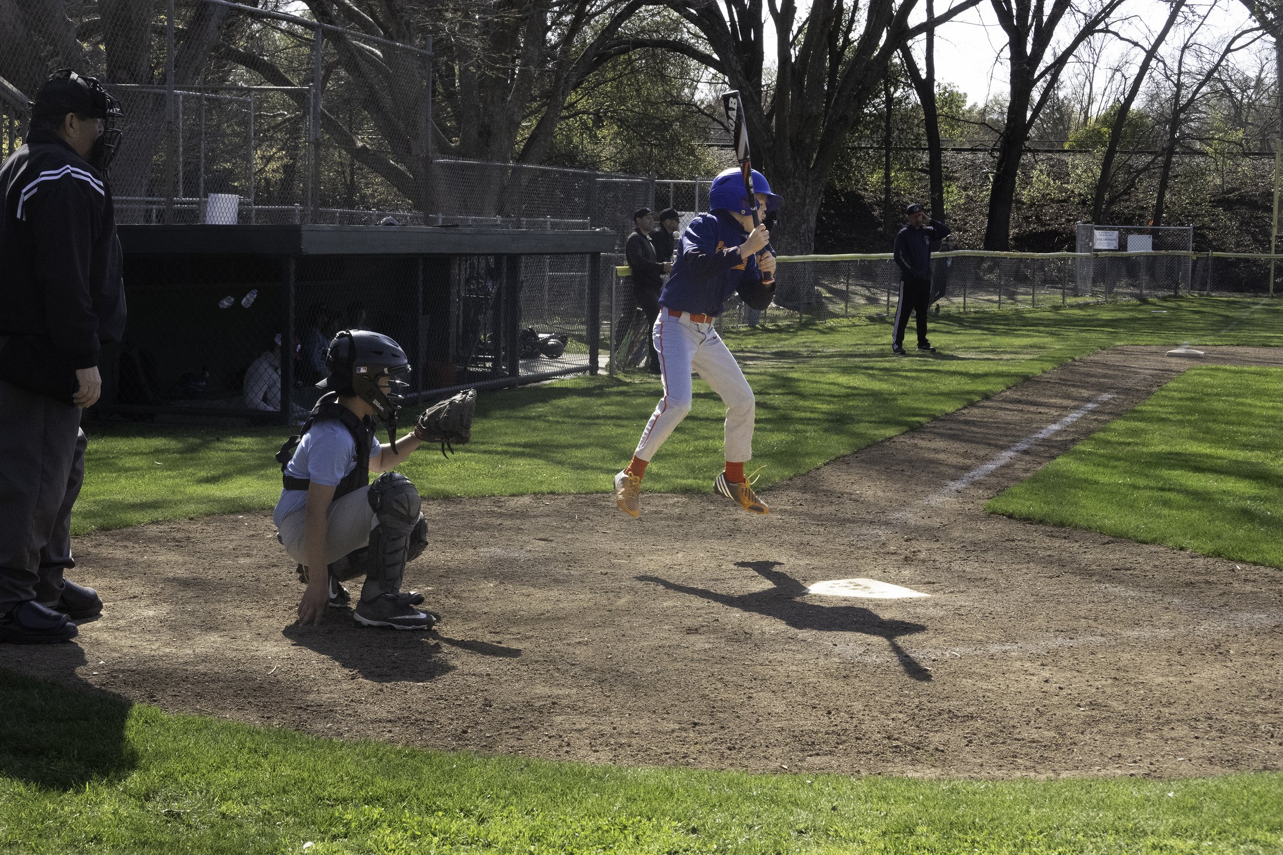 Harvey and his gold shoes do a little jump before stepping up to the plate