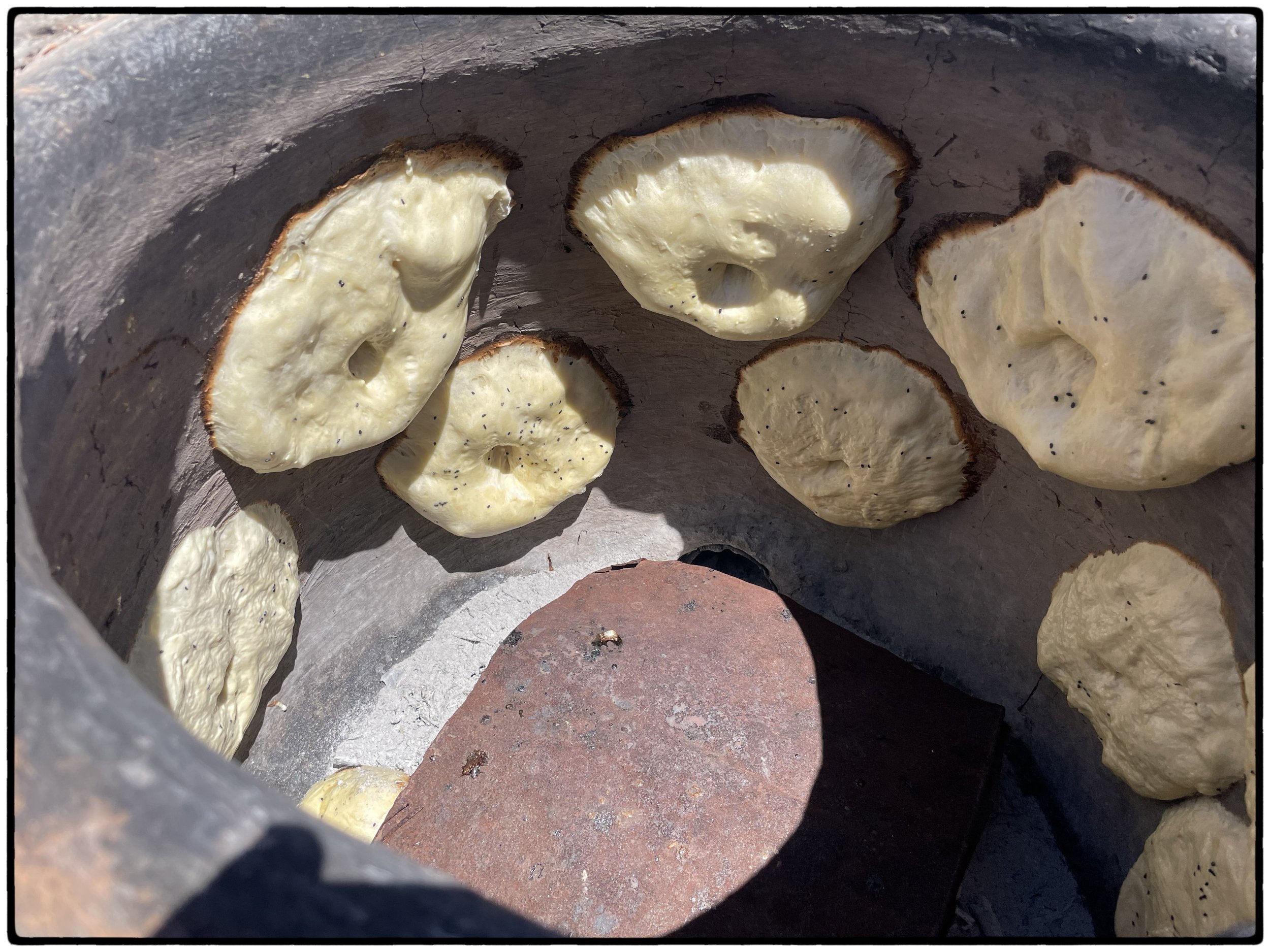  A wood fire was prepared for the dough that was pasted on the walls of the oven.  Best bread ever. 