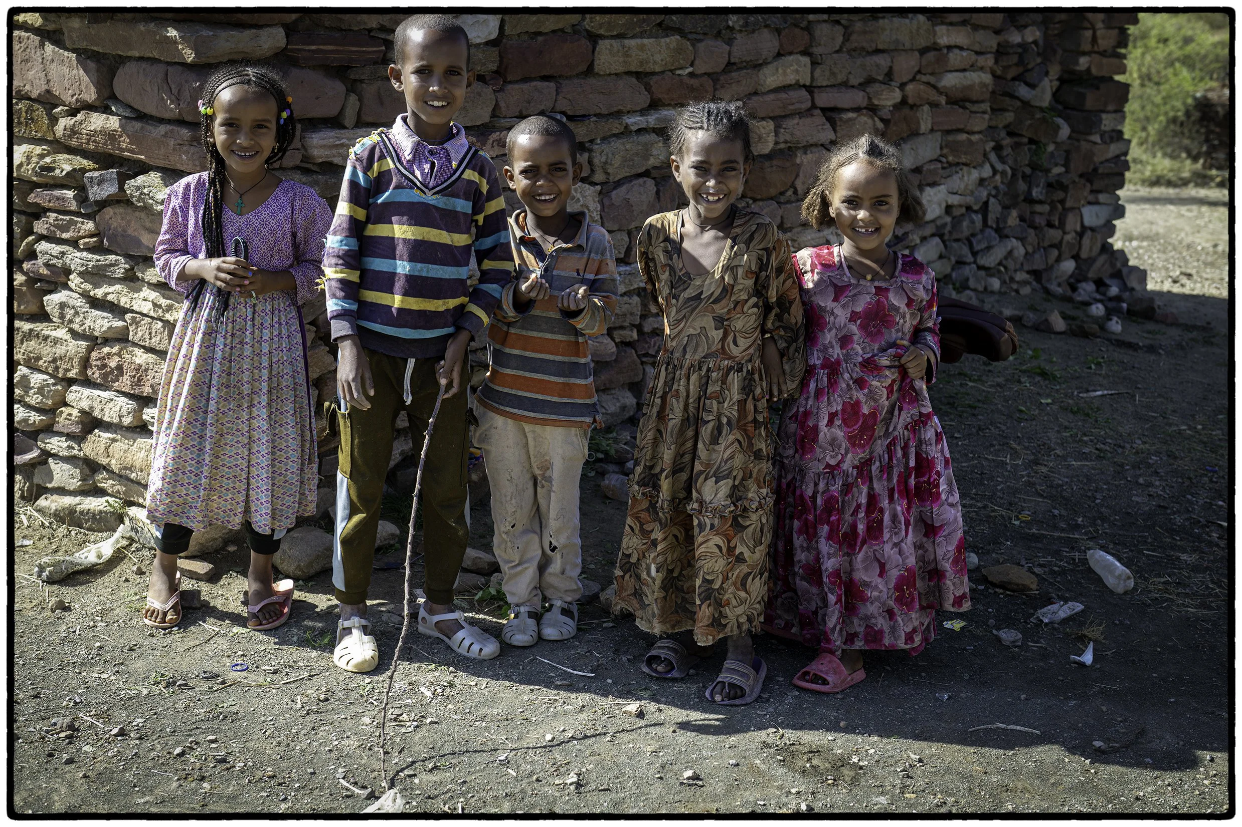Children greeting old white man