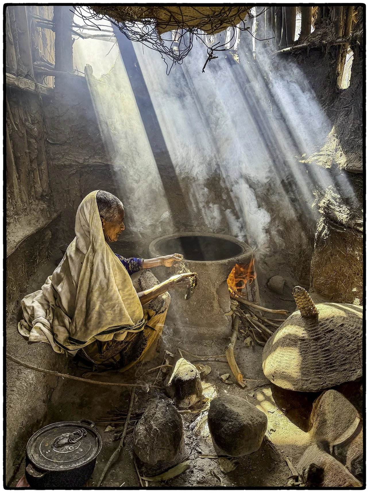 Creating the heat to bake injera