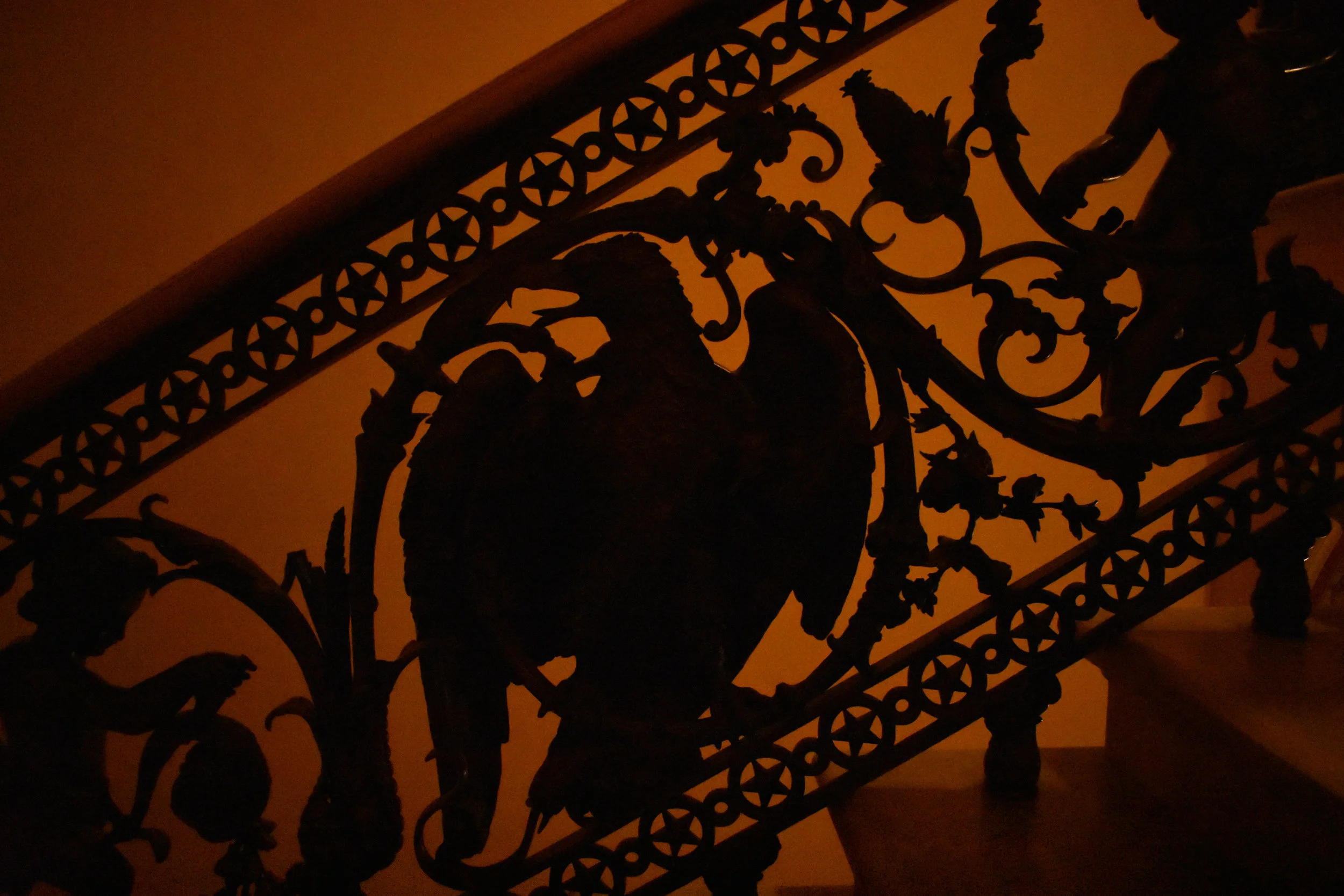 An intricate railing, on a staircase leading up to the second floor of the Senate side of the U.S. Capitol in Washington, is pictured Thursday, Jan. 25, 2018. The eagle, at center, sits between two cherubs. (Lindsey Leake/American University)