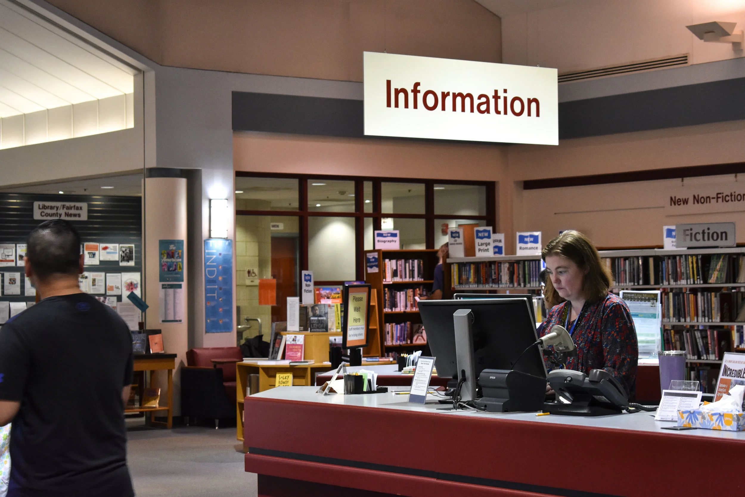 Youth services librarian Letitia Van Campen works the evening shift at George Mason Regional Library in Annandale, Va., Wednesday, Sept. 26, 2018. (Lindsey Leake/American University)
