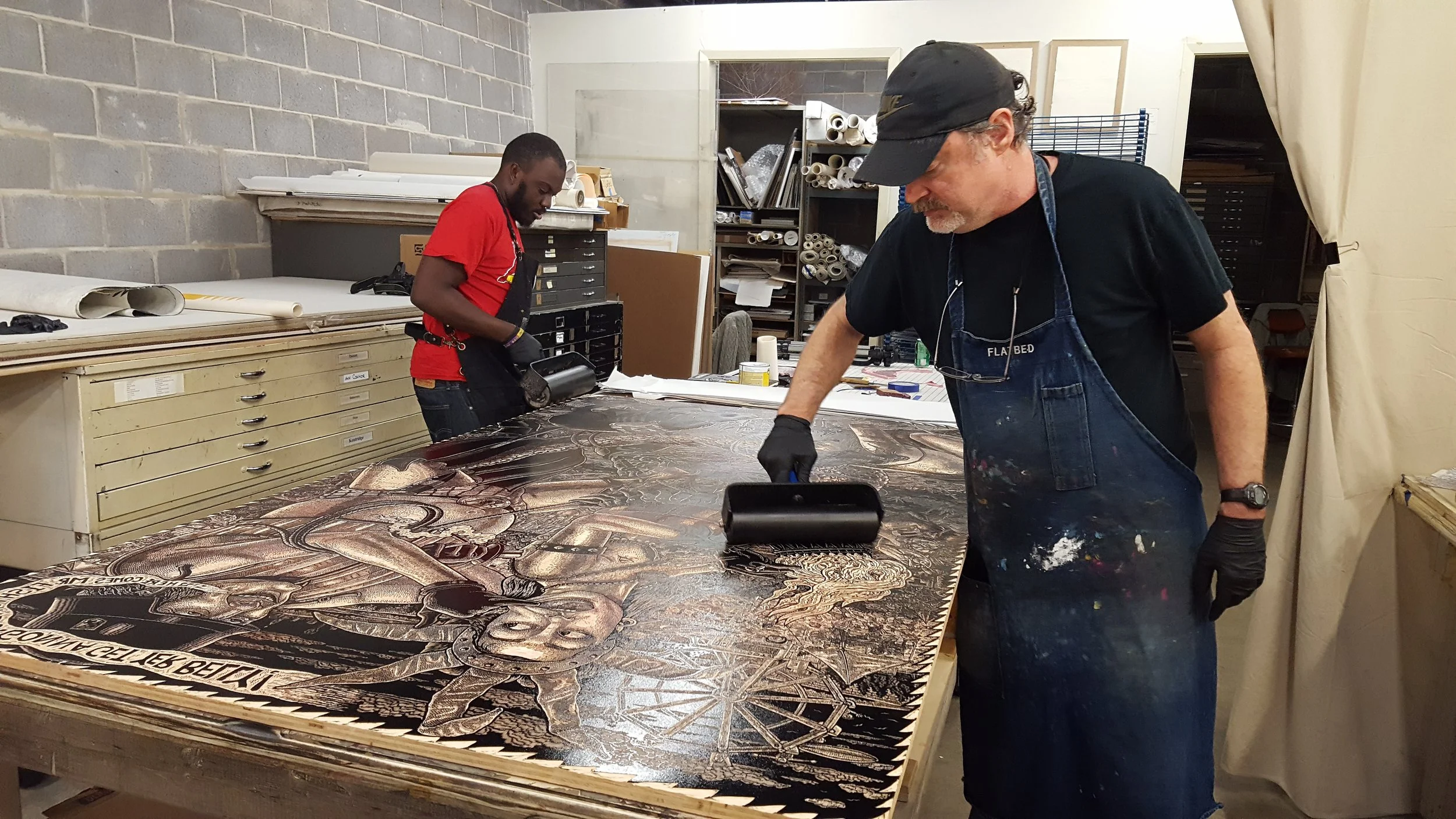 Cameron Gray & master printer Pat Masterson inking the block