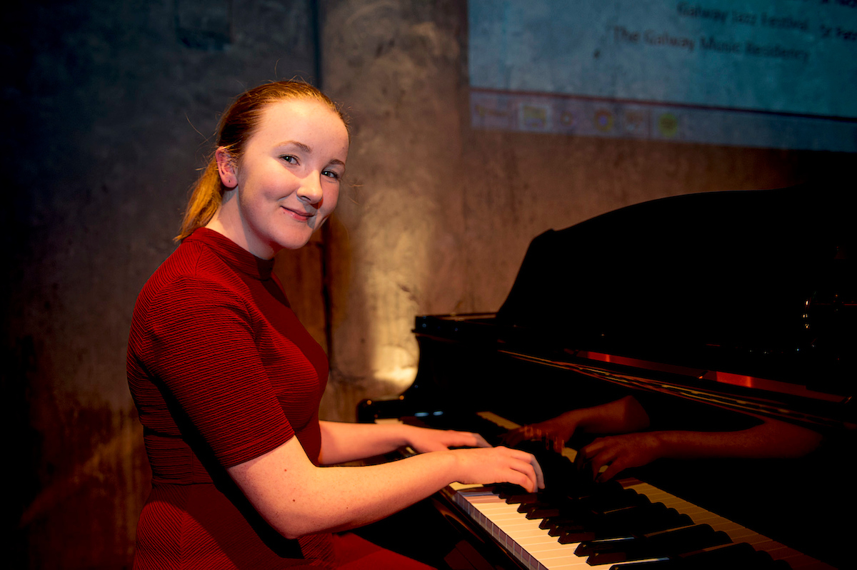 GMC Launch girl on piano.JPG