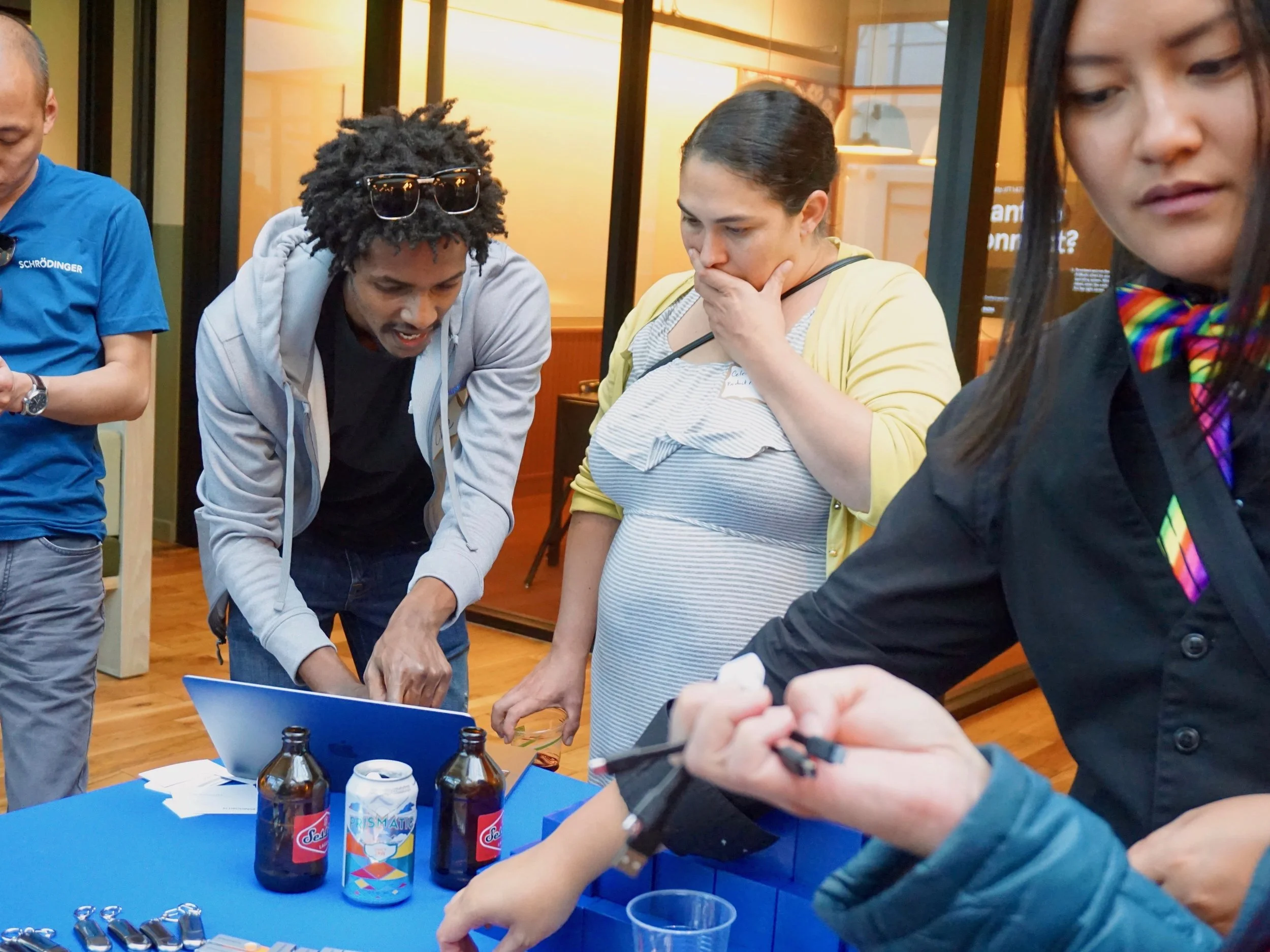 PDXWIT Happy Hour with Schrodinger @ WeWork Pioneer Place, 9/18/18, Attendees learn more about Schrödinger, our hosts, at their booth.