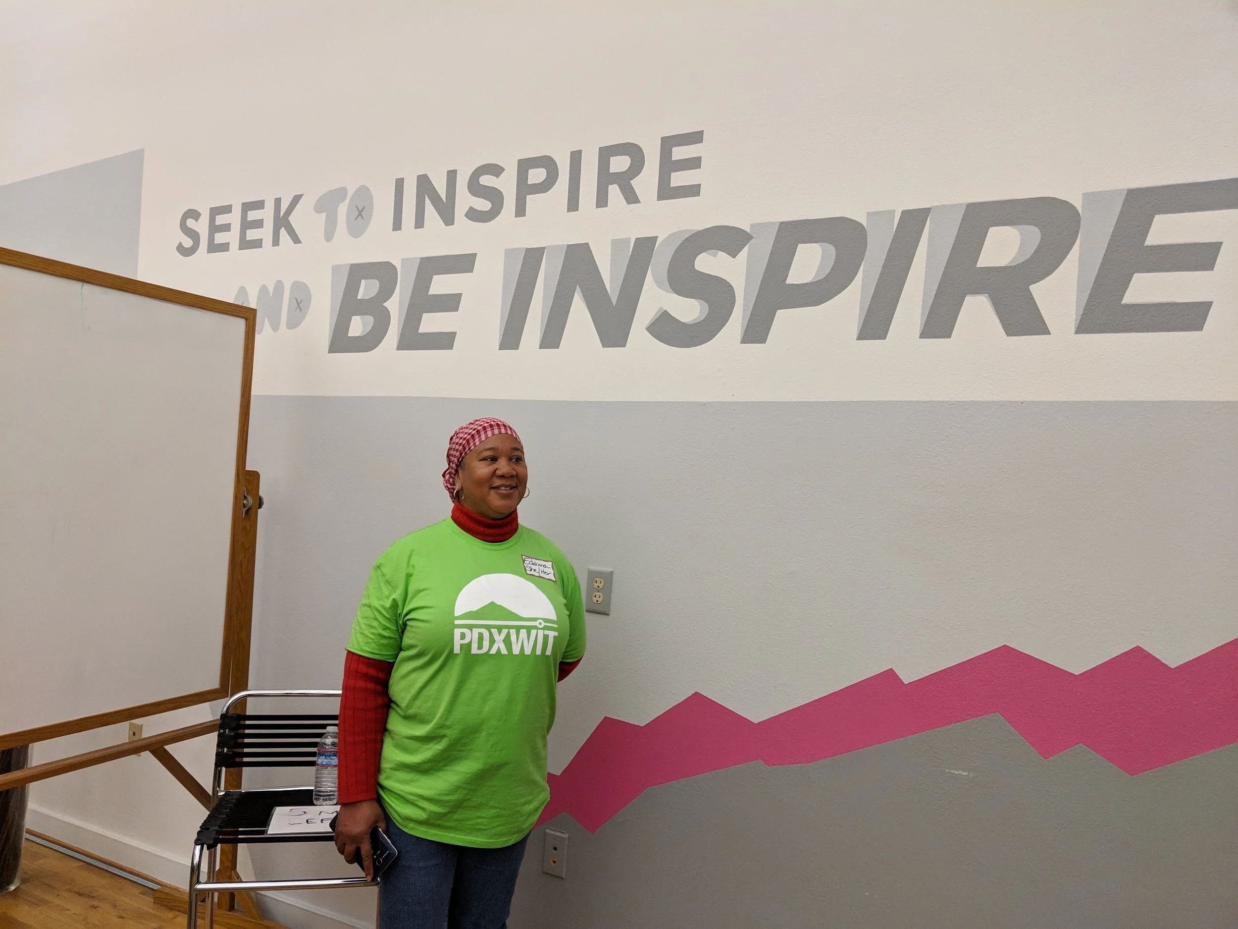 PDXWIT Setbacks to Comebacks in the Creative Industry @ eROI, 11/8/18, A PDXWIT volunteer welcomes attendees