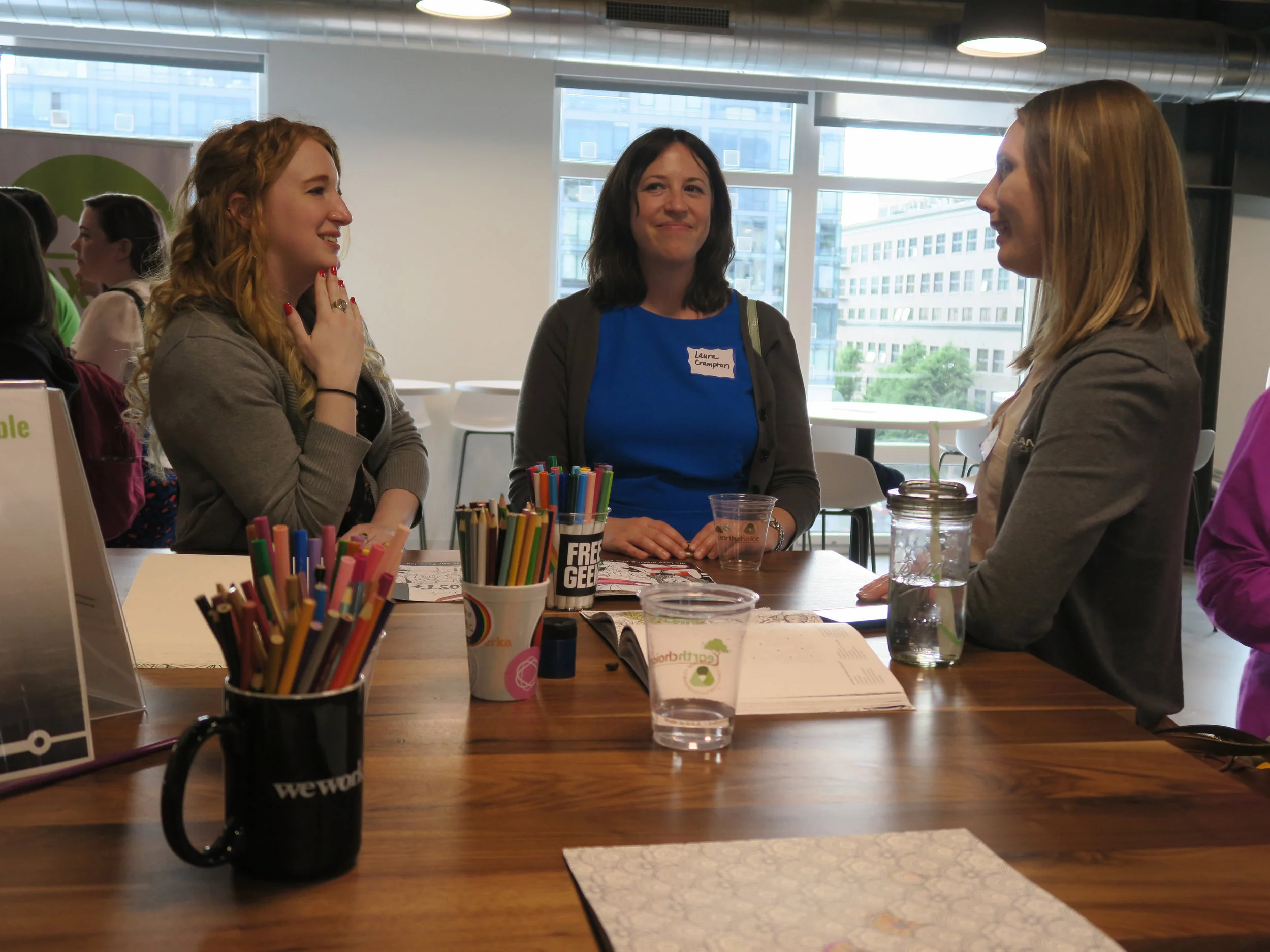PDXWIT-May-Happy-Hour-Vacasa_2019-05-21_networking-at-coloring-table.jpg