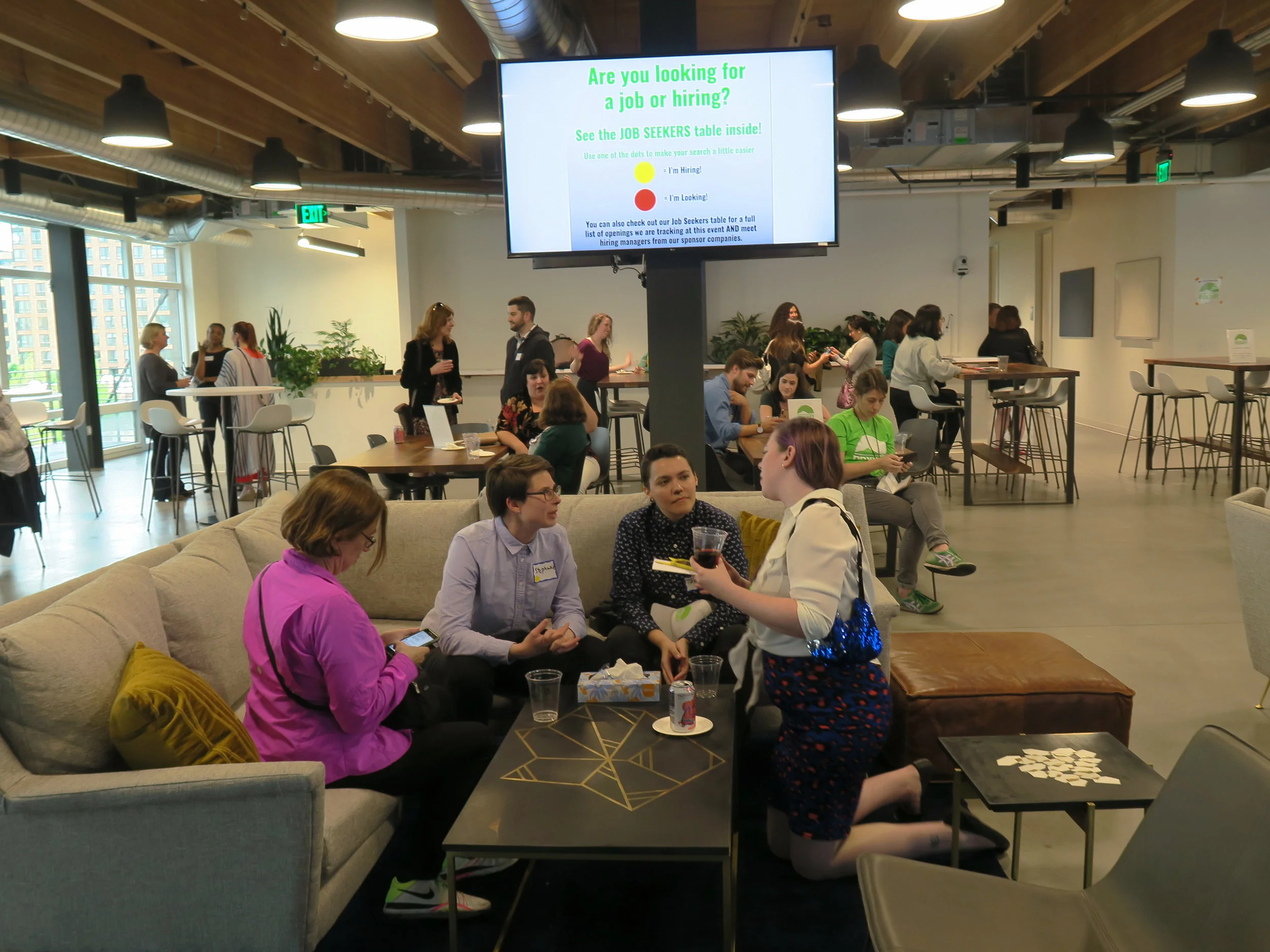PDXWIT-May-Happy-Hour-Vacasa_2019-05-21_networking-on-couch.jpg