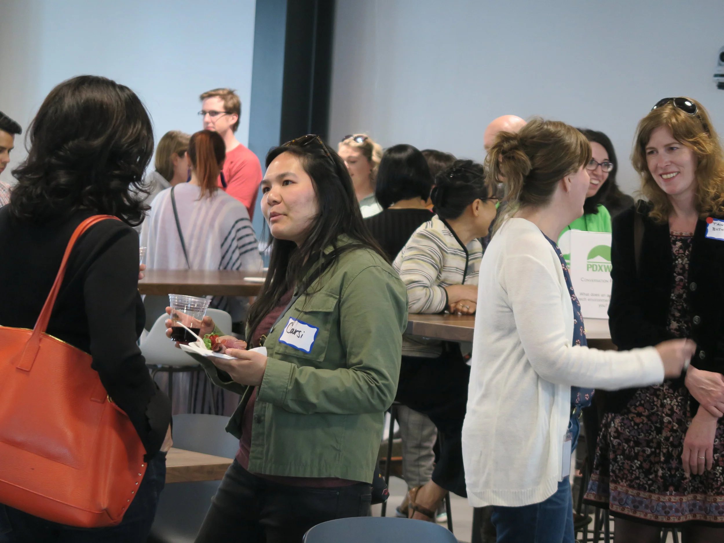 PDXWIT-May-Happy-Hour-Vacasa_2019-05-21_networking-women-talking.jpg