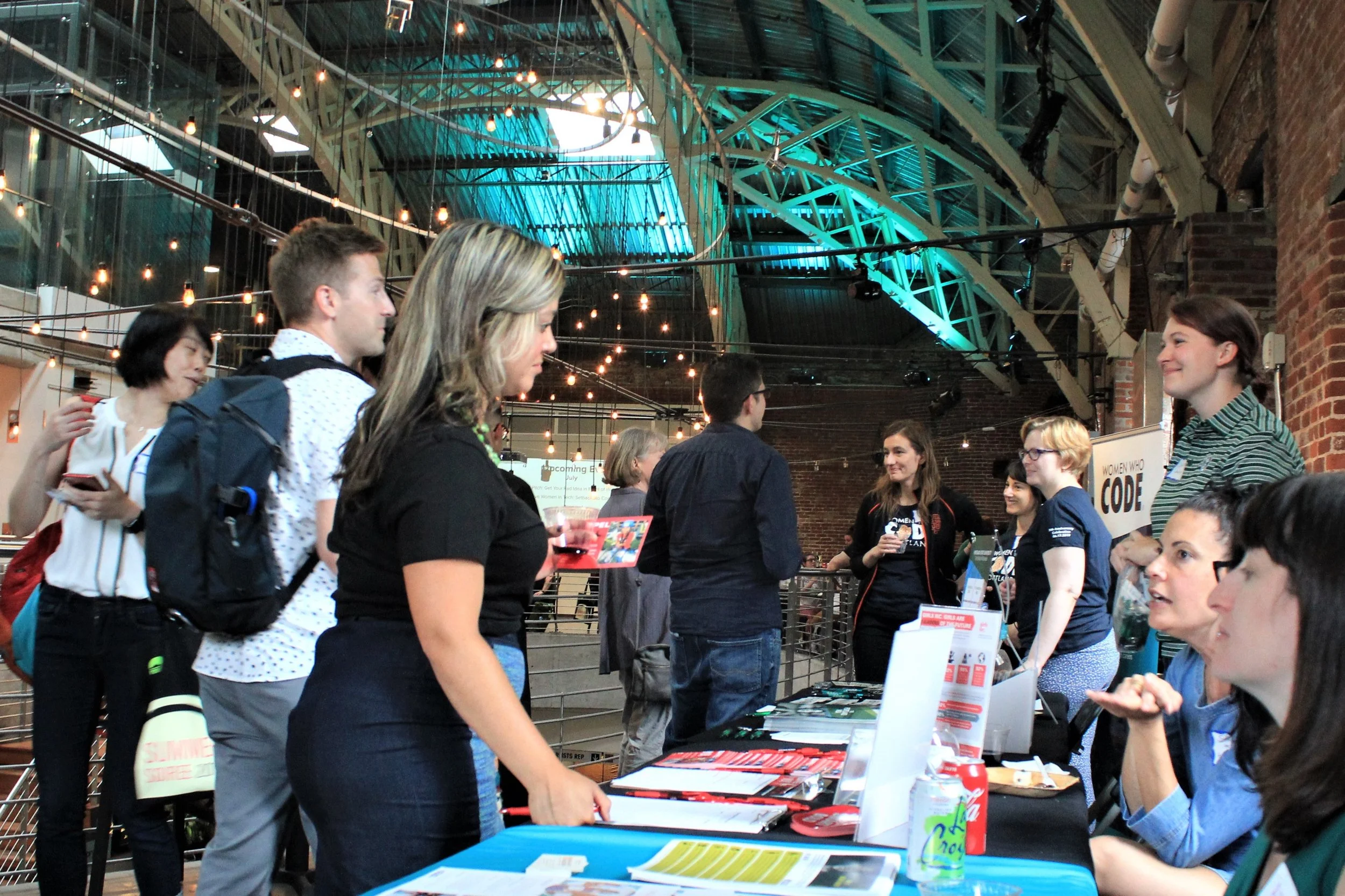 People talking at sponsor table (2).jpg