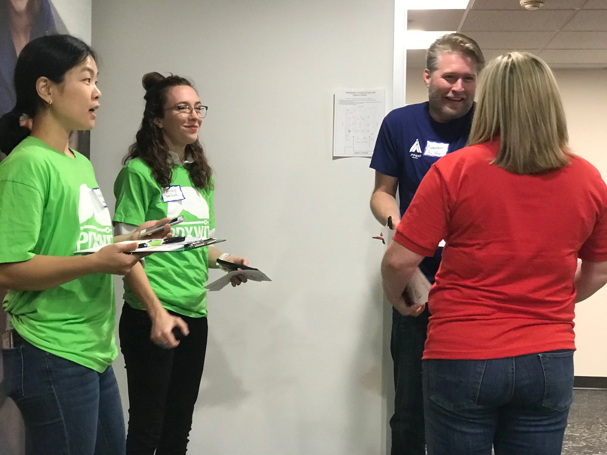Attendees and volunteers chatting.jpg
