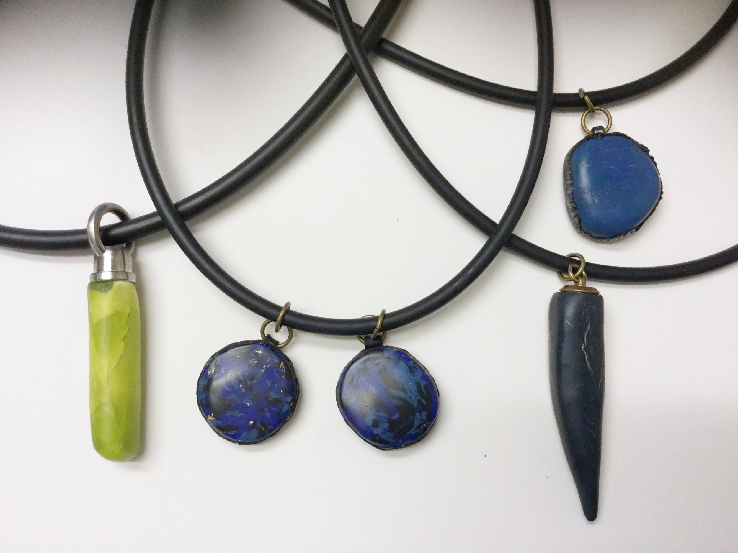 Chunky necklaces with faux elements.