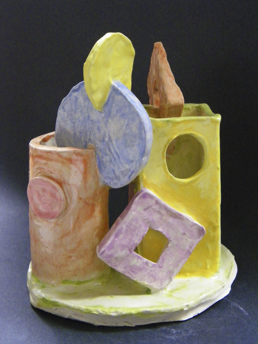 Students used shapes and color to describe family members and their relationship to each other. They assembled the individual pieces with attention to shape and form, learning how to score and slip while they built their ceramic forms. This was prompted by efforts to understand how a non-figurative sculpture can have meaning to the maker.