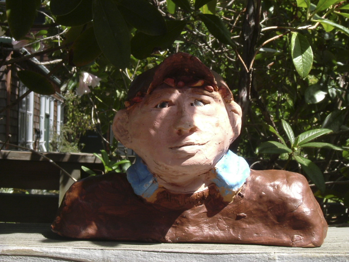 Students were challenged to create a self portrait bust. They learned how to use paper armatures to support clay work over time, using an additive technique to add details.