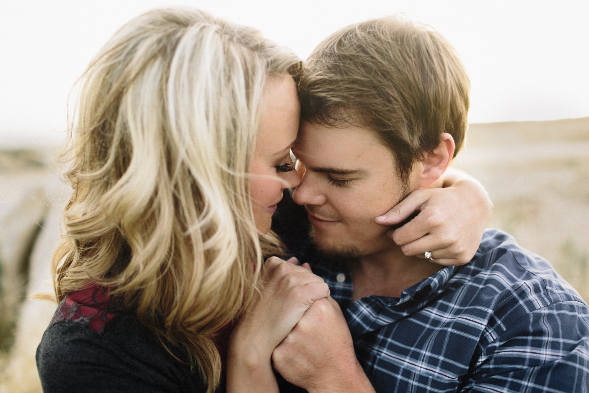 A young couple in love, with their foreheads pressed together, photographed by Lauren Guiffre of Boise Idaho