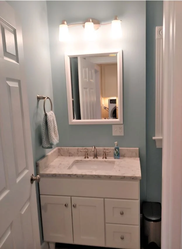 Half bathroom vanity with quartz countertop in Hudson, MA