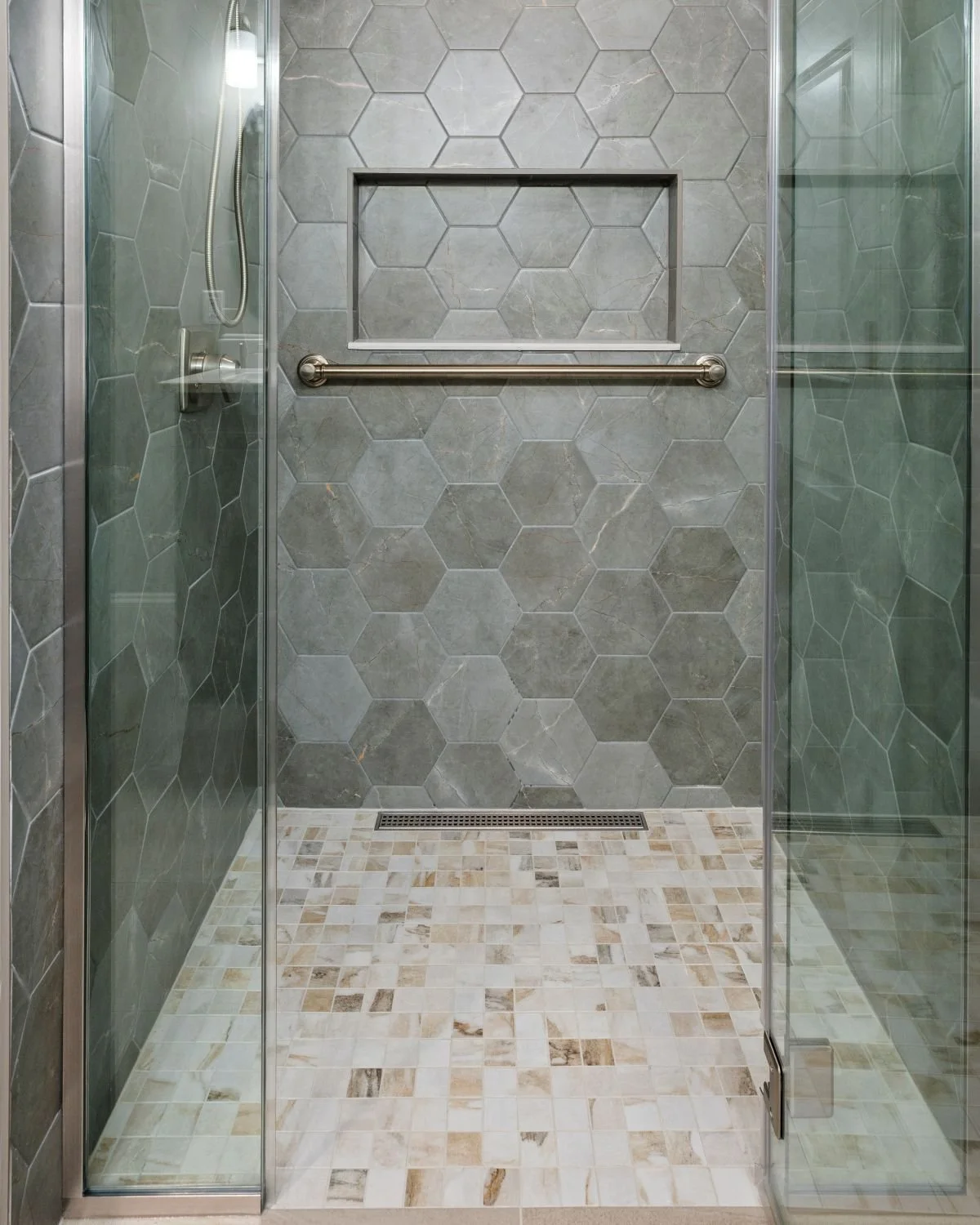 Custom tiled zero-entry shower floor with Livingstone Melange 5cm tile, luxury bathroom remodel Holden MA