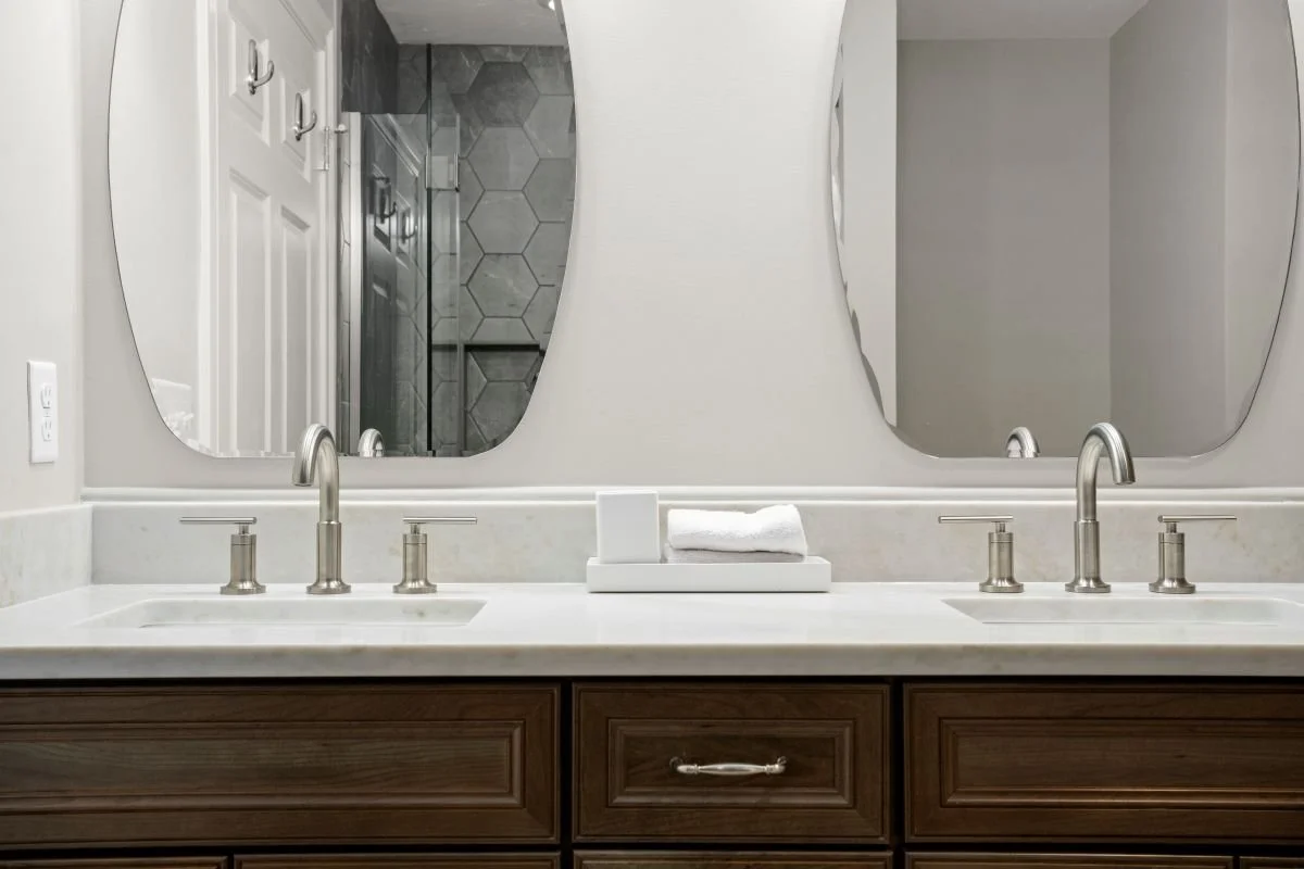 Taj Mahal quartz countertop with undermount sink and satin nickel Chesapeake hardware, luxury bathroom remodel Holden MA