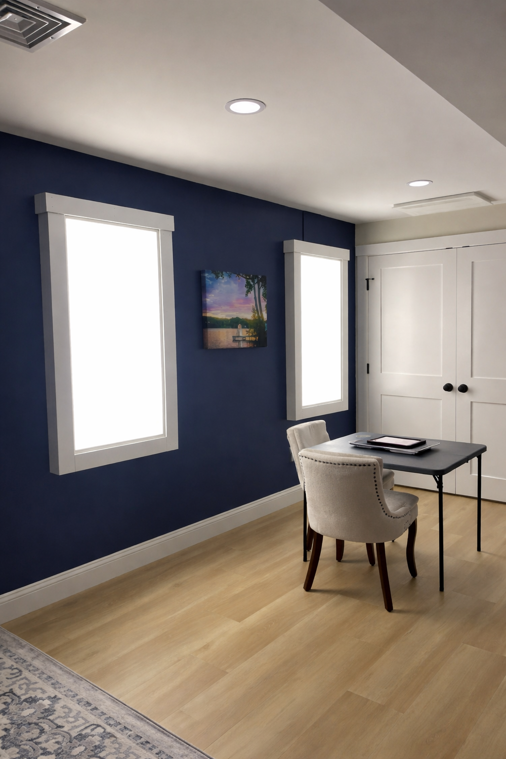 Faux window LED panels turned on in a finished basement remodel in Boxborough, MA