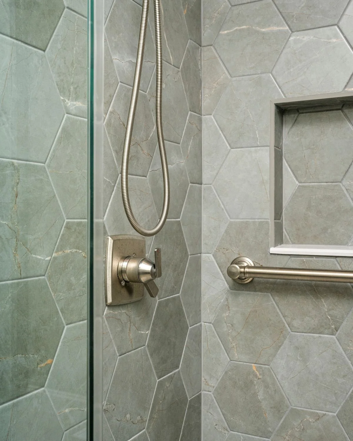 Pulpis Dark Grey 20x24 hex tile shower walls with Battleship grout, luxury bathroom remodel Holden MA
