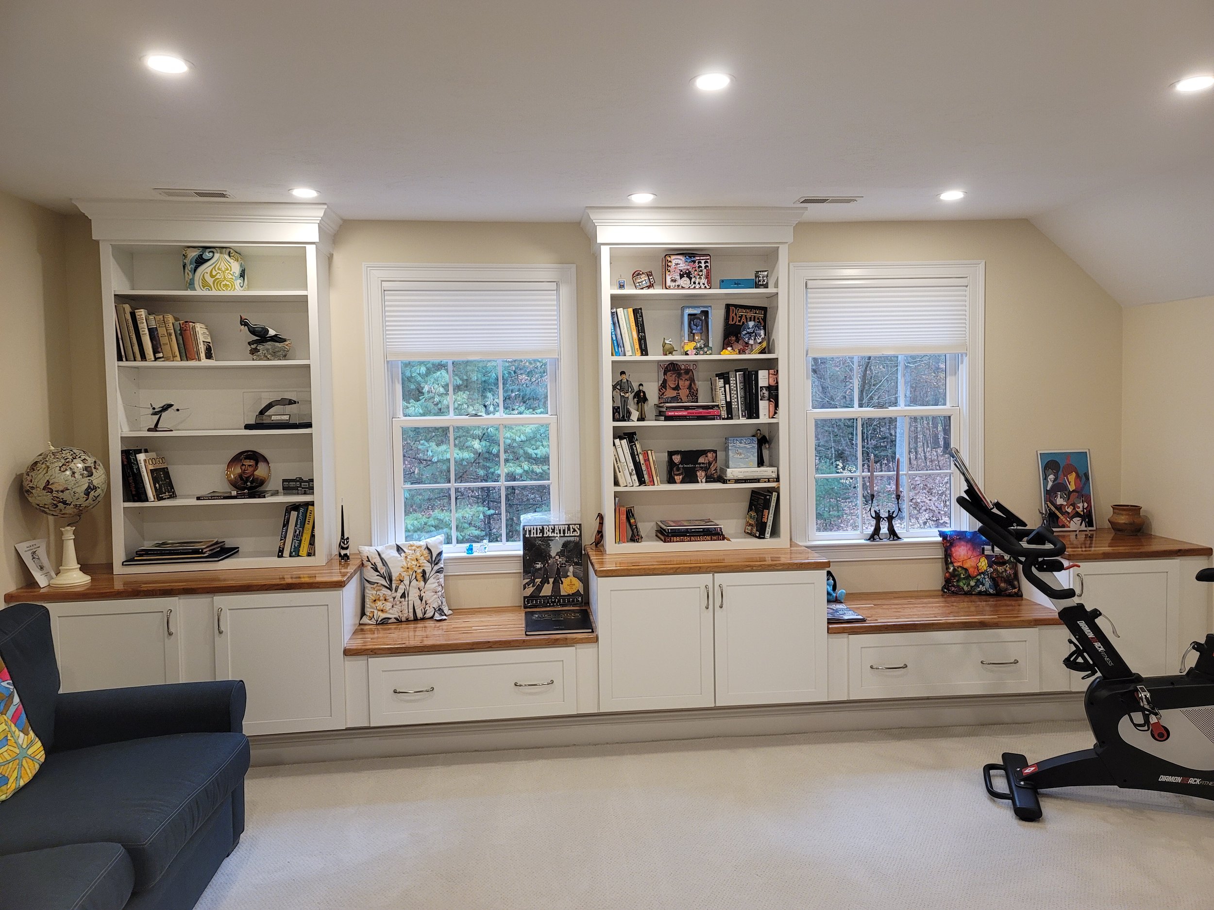 Custom bonus room built-ins in Stow MA with Waypoint cabinetry, window seating, and integrated shelving