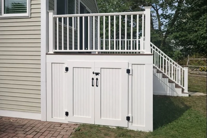 Integrated storage below elevated deck in family room addition