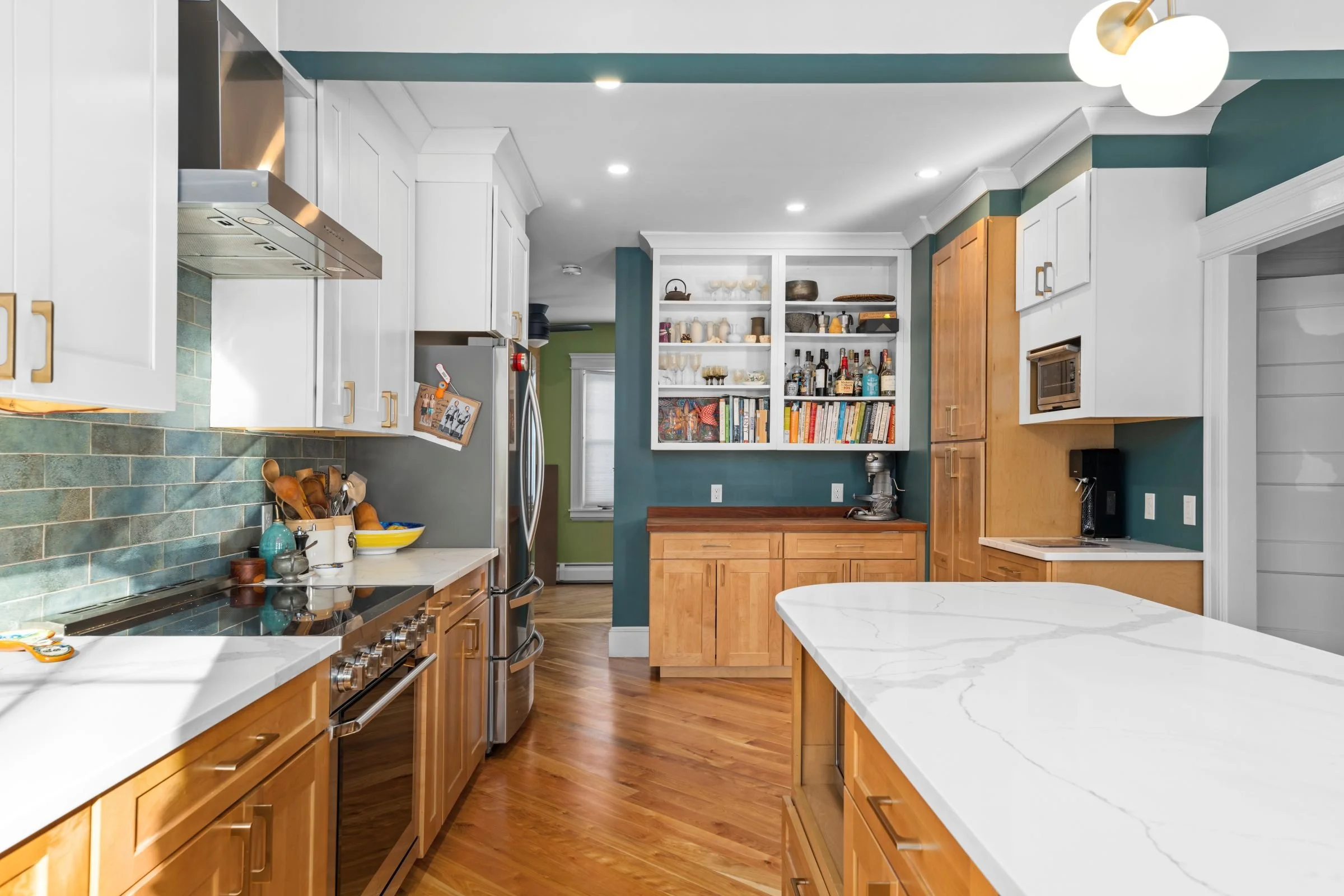 Worcester MA kitchen remodel open shelving and bar area with butcher block countertop, built-in cabinetry, and beverage station.