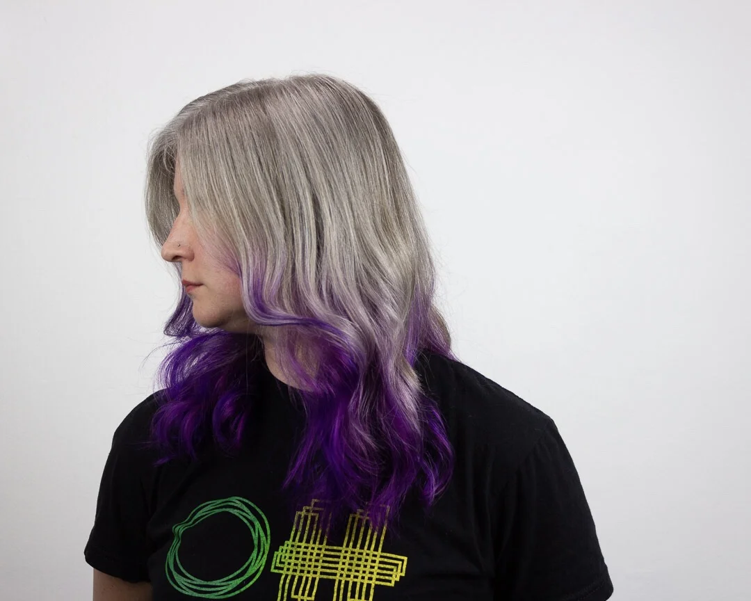 Use your natural grey hair through personal expressions. Natural grey highlighted and toned with a party shade. Hair by Allie.