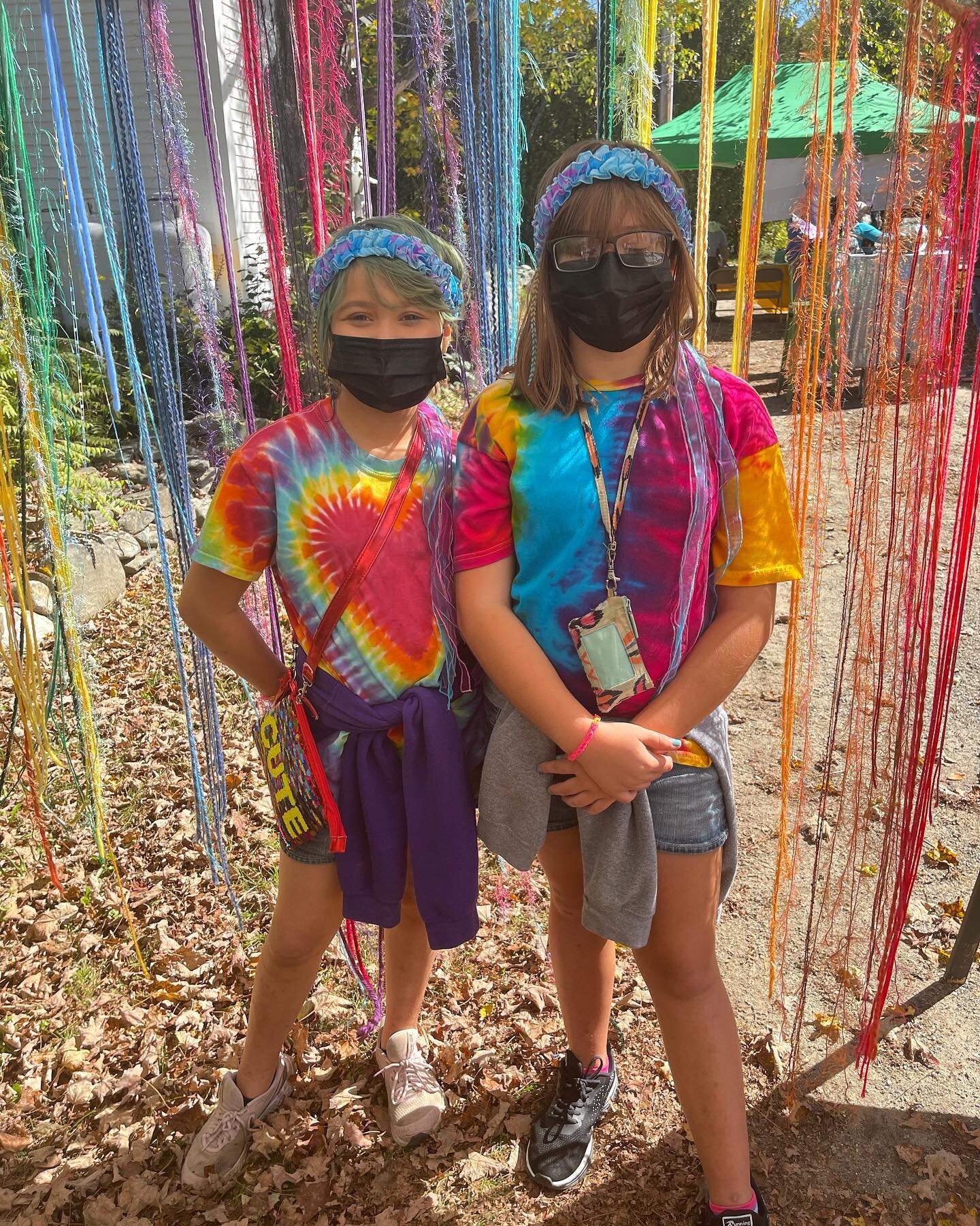 Two friends in rainbow tie dye with rainbow hair feathers standing in front of our rainbow macrame taken at the @vermontnaturemuseum fairy house festival on Saturday. Too good not to share! ❤️🧡💛💚💙💜
.
.
.

&ldquo;Why are there so many
Songs about